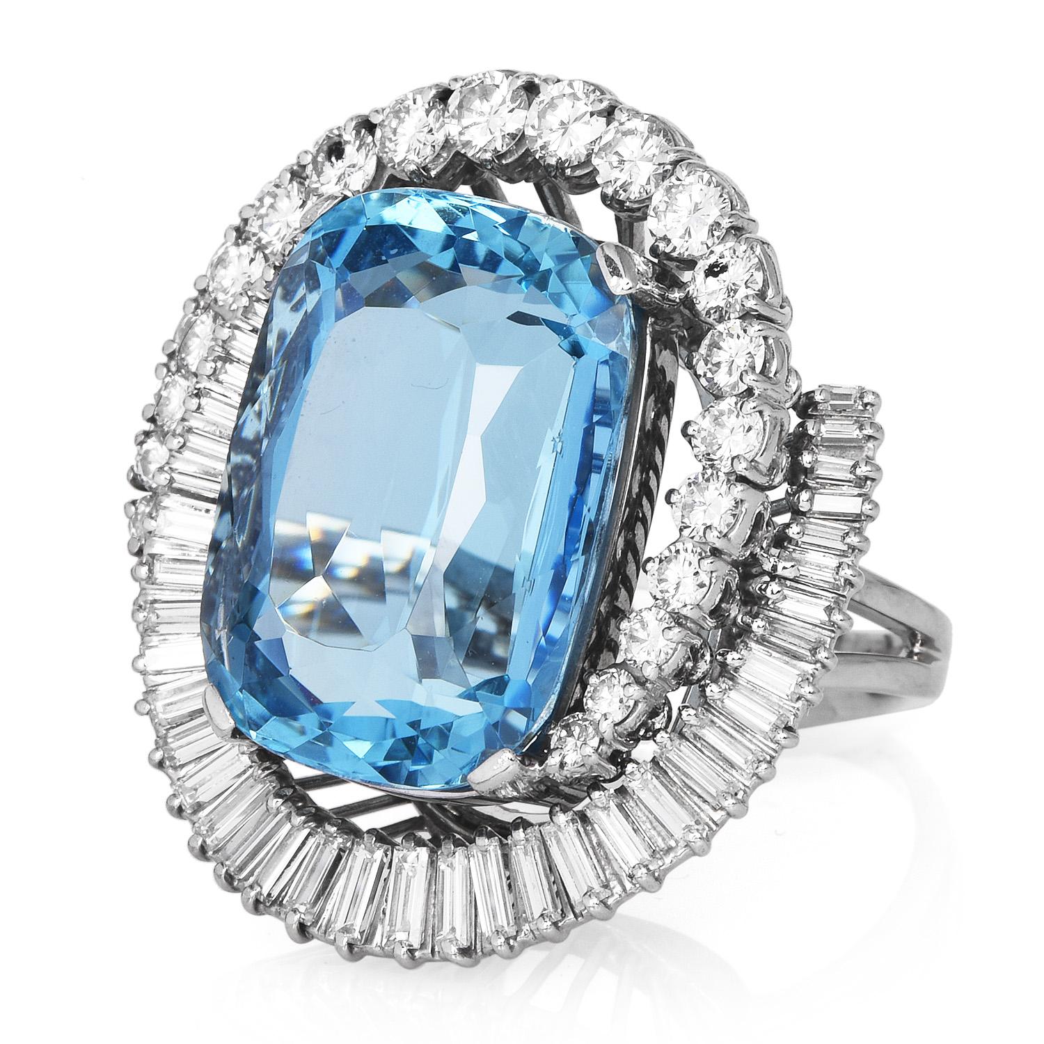 A look into a wave in the bluest ocean! A striking, appx. 23.07-carat Cushion cut Aquamarine H-Sten ring with GIA lab Report adorns the center of this incredibly mesmerizing ring.

The vintage H Stern bypass halo design of the diamonds creates
