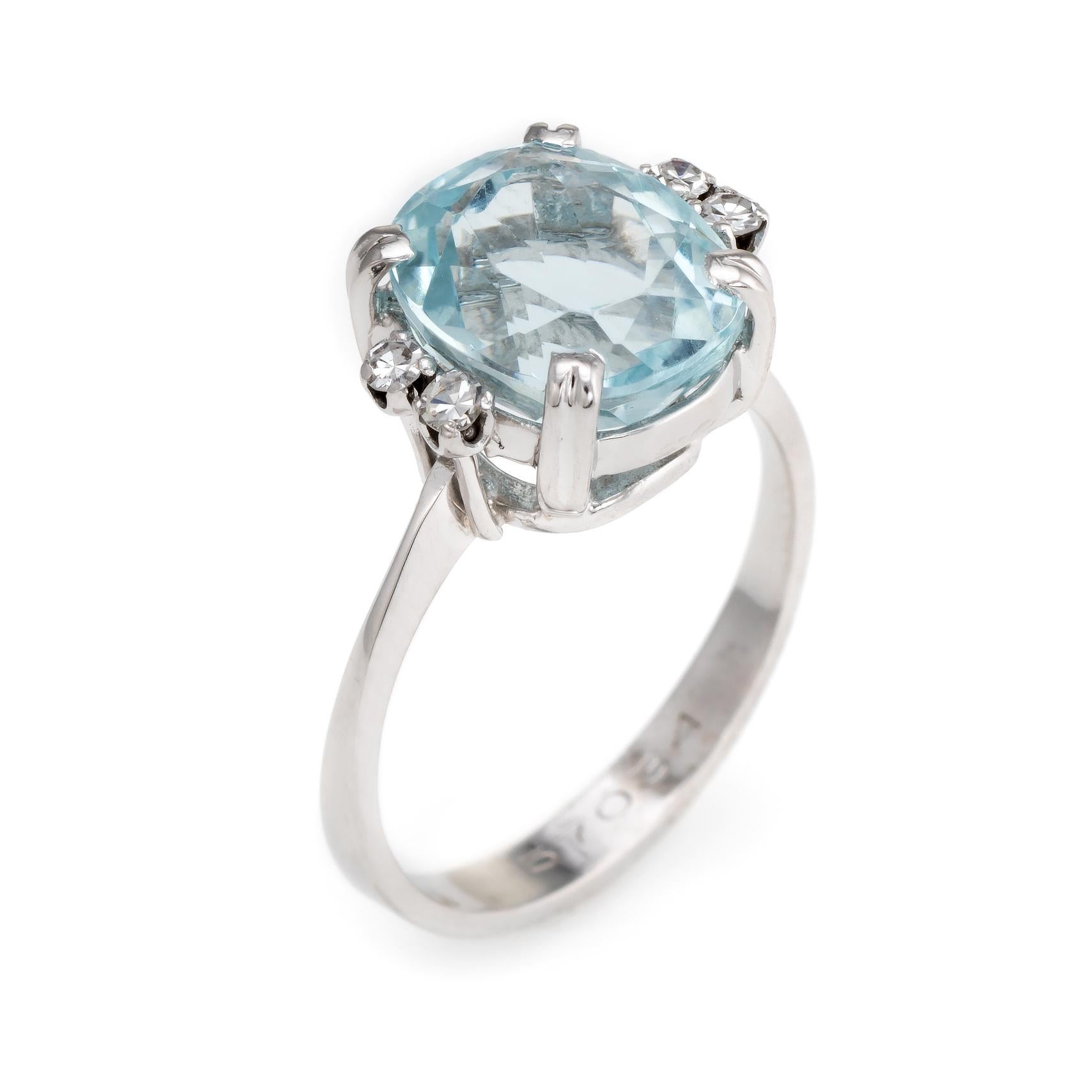 Finely detailed H Stern aquamarine & diamond ring (circa 1950s to 1960s), crafted in 18 karat white gold. 

Faceted oval cut aquamarine measures 10.5mm x 9mm (estimated at 5 carats), accented with four estimated 0.02 carat single cut diamonds. The