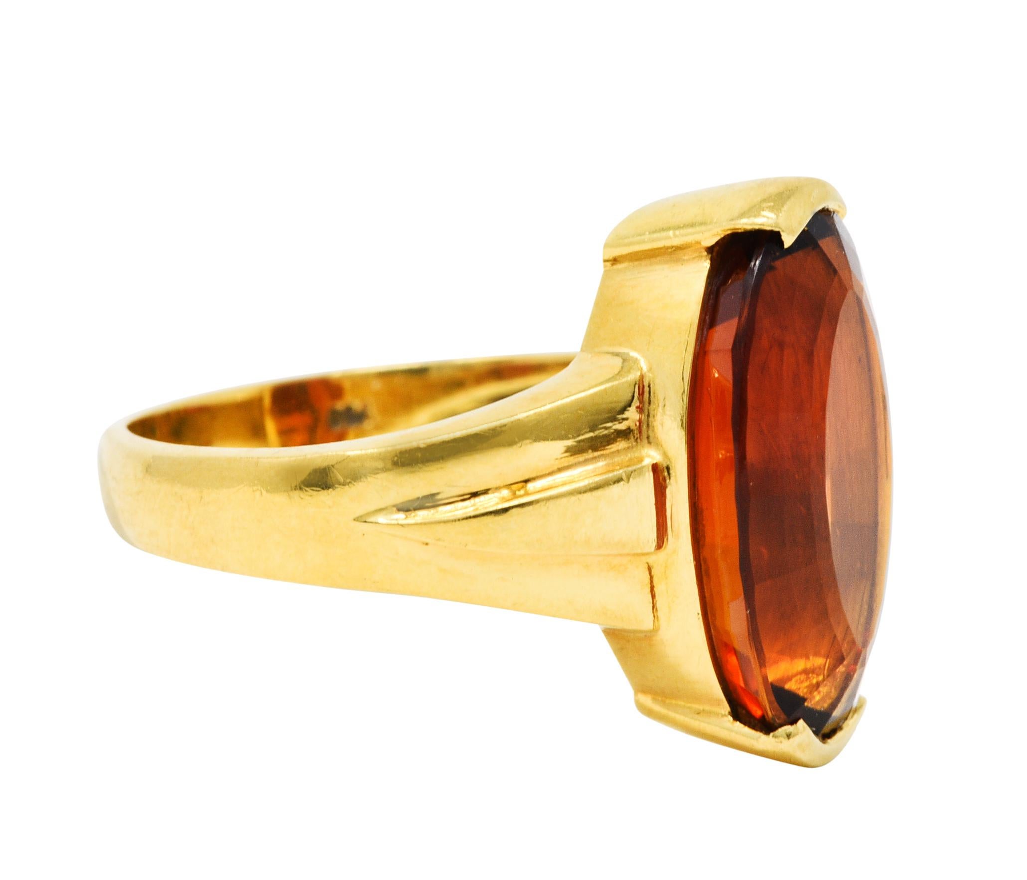 Featuring an oval mixed cut citrine measuring approximately 15.5 x 10.0 mm

Half bezel set and exhibits strong brownish orange color

Completed by stylized geometric shoulders

Stamped 750 for 18 karat gold

Maker's mark for H. Stern

Circa: