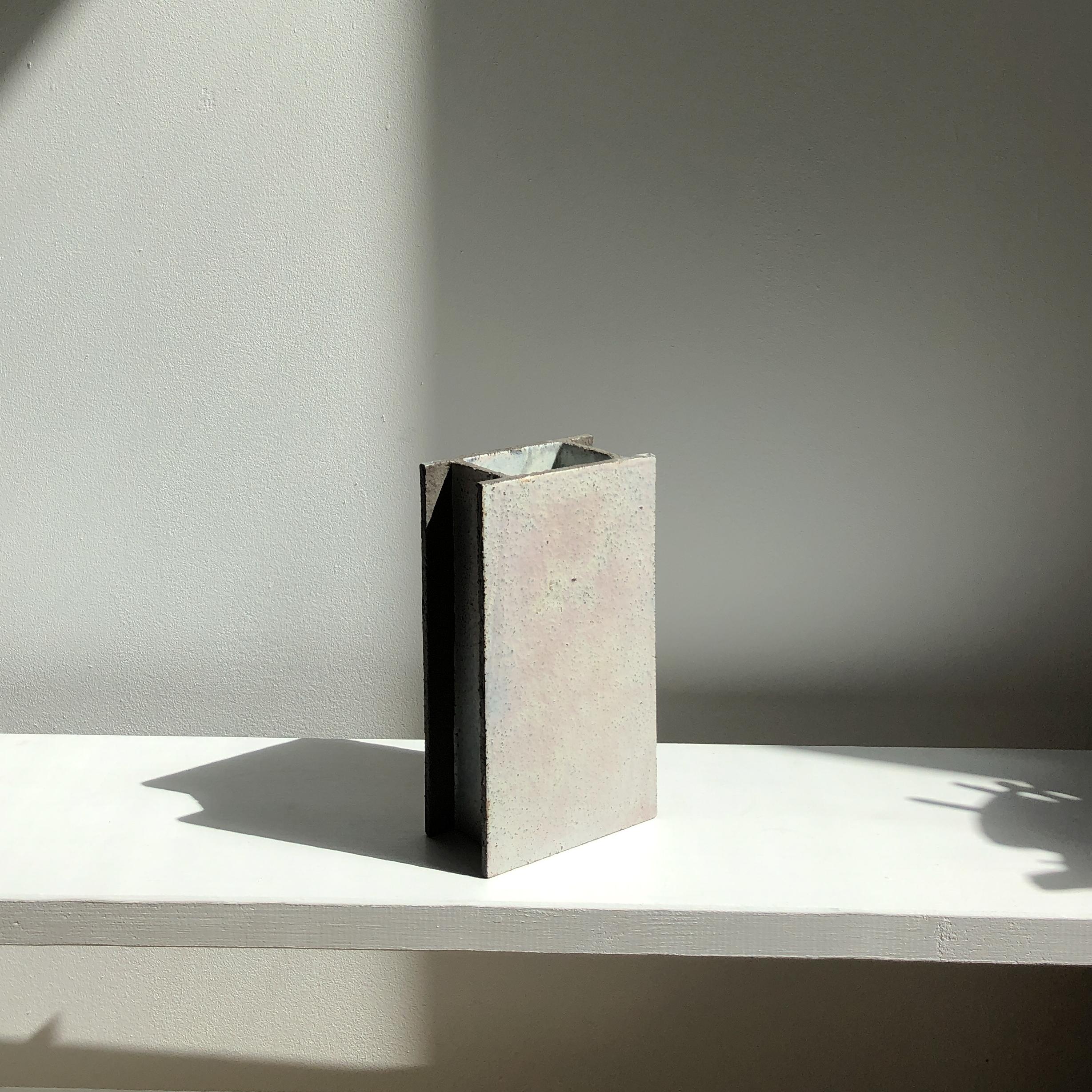 H Vase by Wendy Taylor
Dimensions: D12 x W6.5 x H21.8 cm
Materials: stoneware

Stoneware, matt glazed. Glaze colour/ surface pattern will vary.

Wendy Taylor's clay slab constructed works are influenced by elements of the built environment,