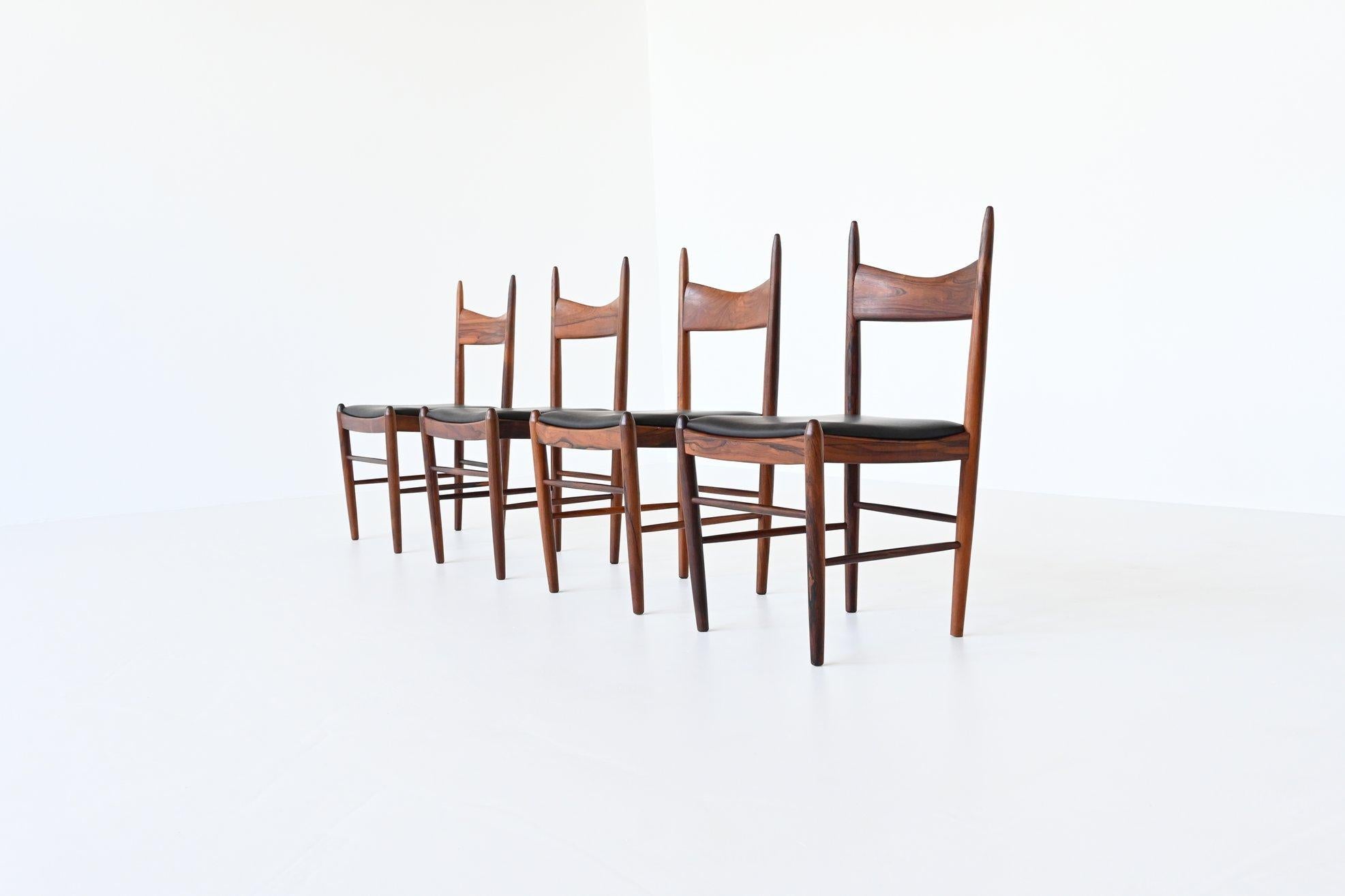 Stunning set of four dining chairs designed by H. Vestervig Eriksen for Brdr. Tromborg, Denmark 1960. These amazingly shaped chairs are made of beautiful grained solid Brazilian rosewood and the seats are upholstered with high quality black aniline