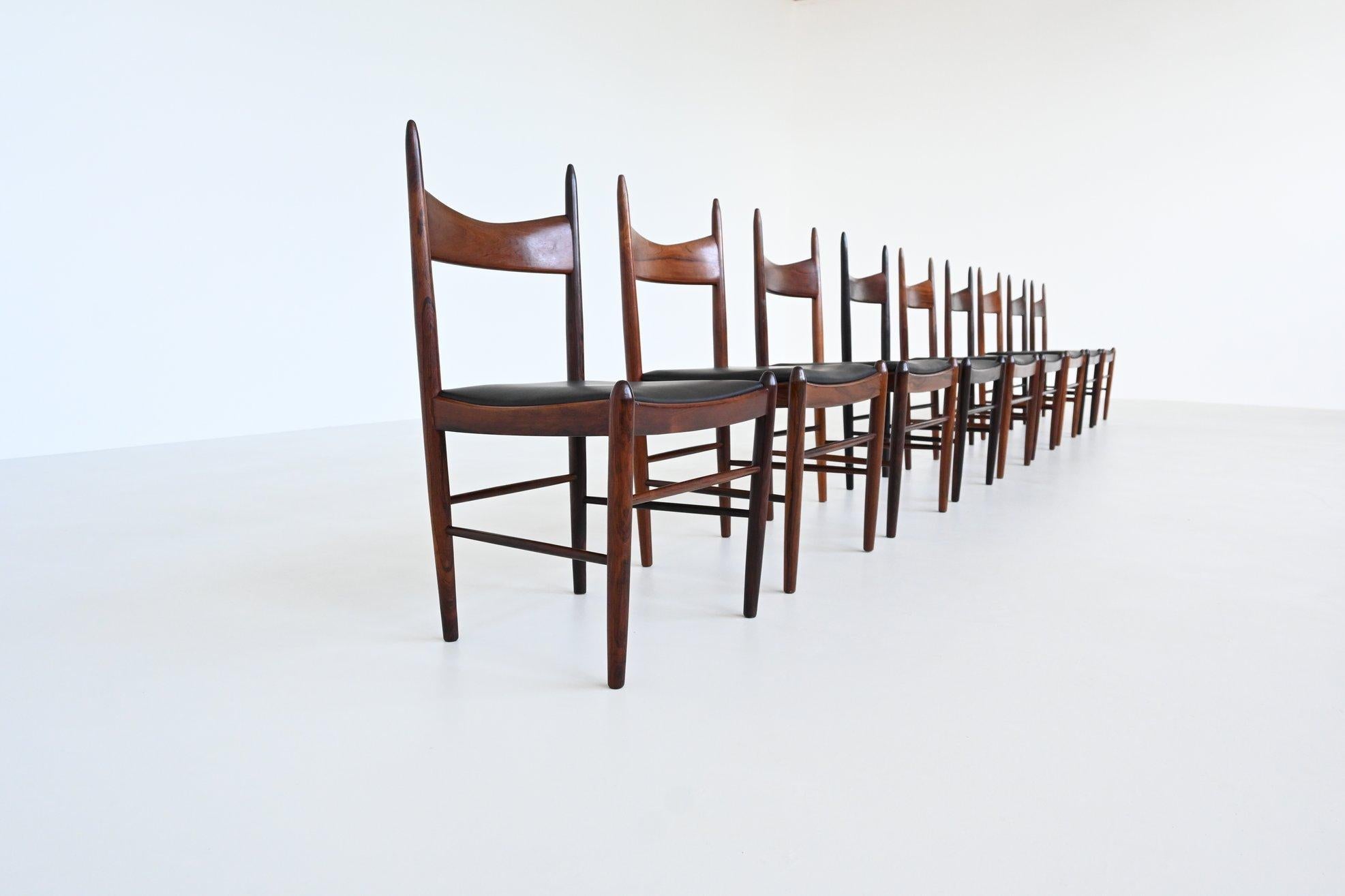 Stunning set of nine dining chairs designed by H. Vestervig Eriksen for Brdr. Tromborg, Denmark 1960. These amazingly shaped chairs are made of beautiful grained solid rosewood and the seats are upholstered with high quality black aniline leather.