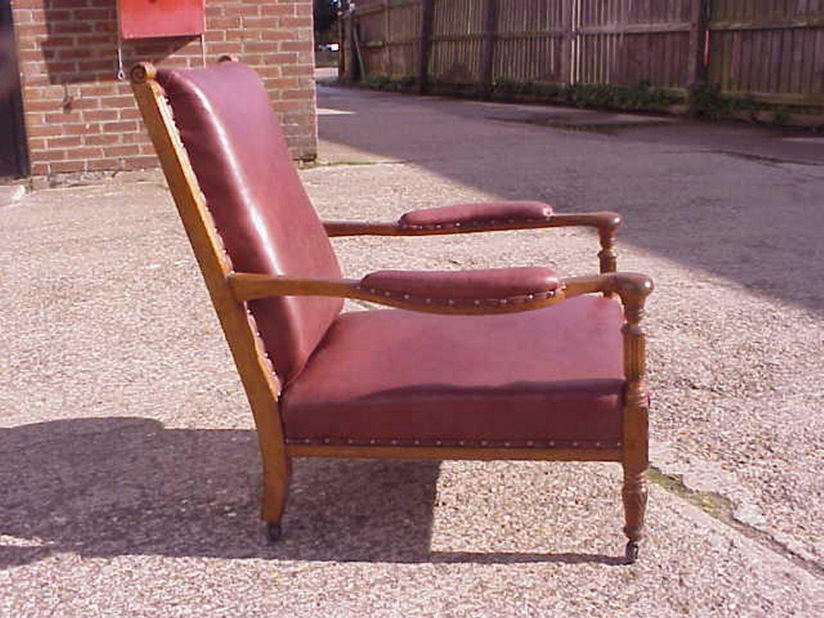 English Henry William Batley attri,  Jas. Shoolbred. An Aesthetic Movement Oak Armchair. For Sale