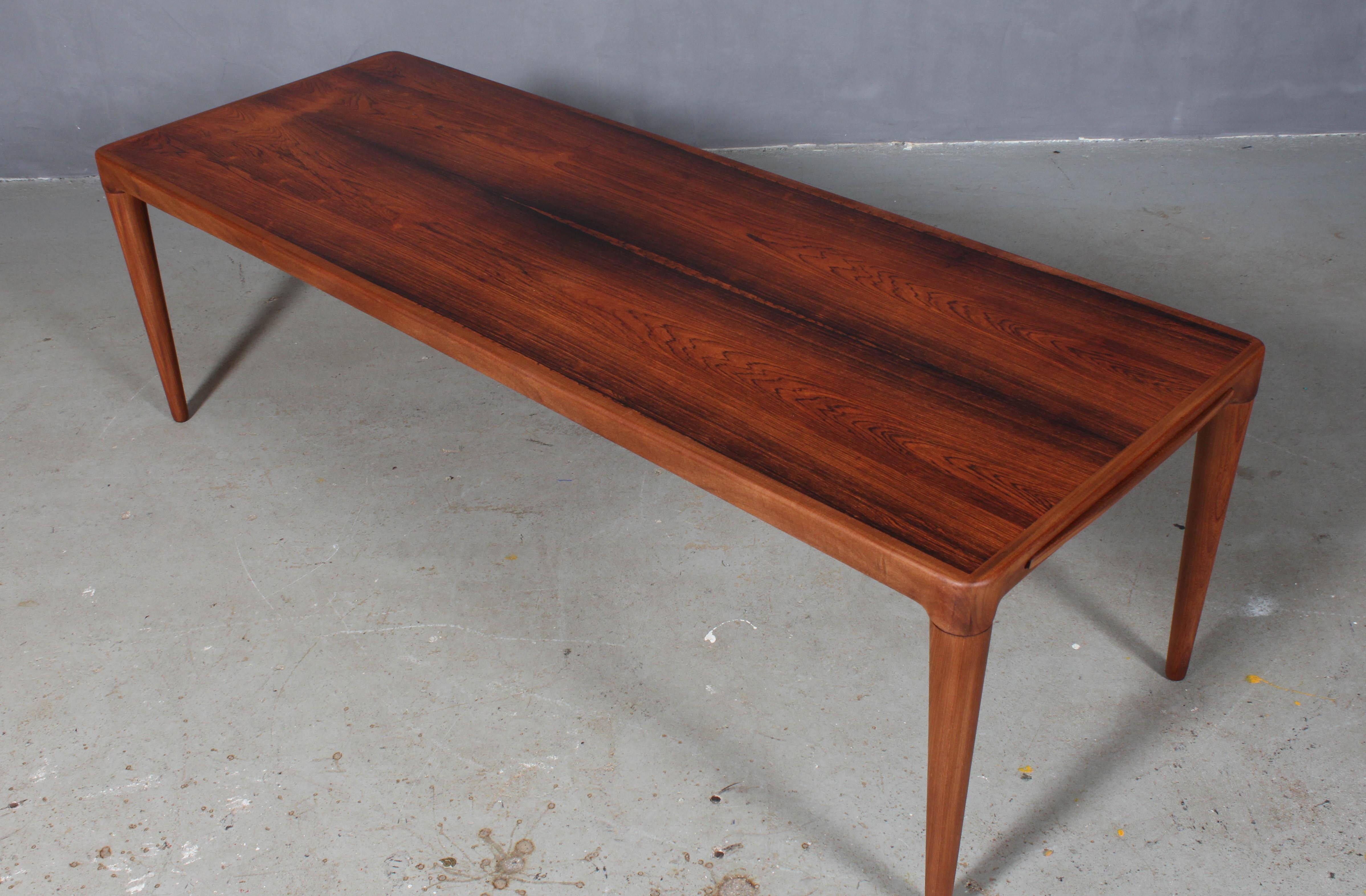 H. W. Klein coffee table in partly solid rosewood.

One extension leaf with black Formica.
 
