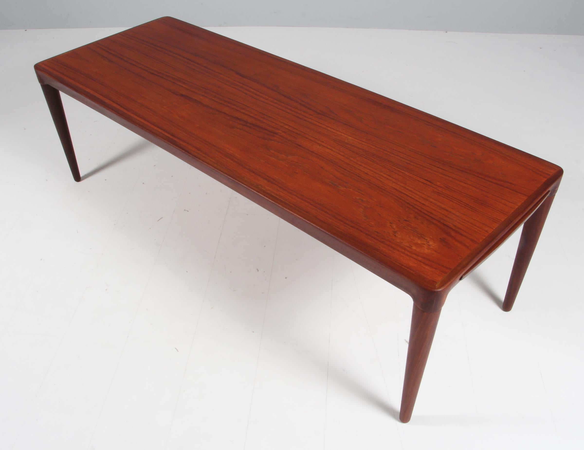 H. W. Klein coffee table in partly solid teak.

One extension leaf with black Formica.
 