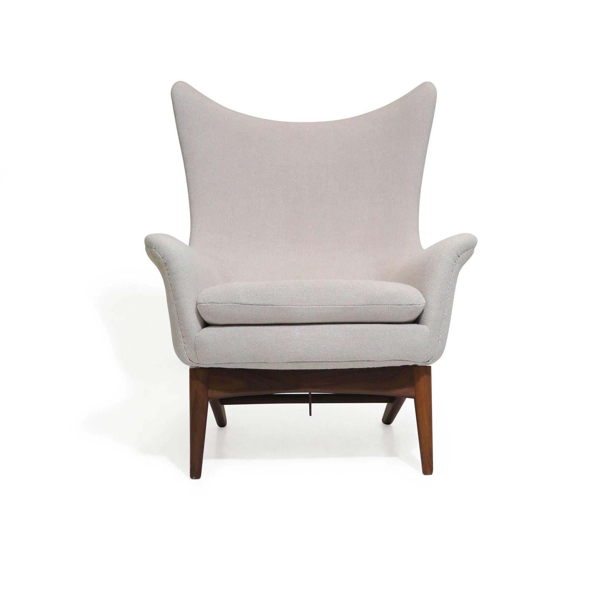 Danish reclining lounge chair designed by H.W Klein for Bramin Moblefabrik, circa 1960 Denmark. The chair is crafted of a solid wood frame with manual reclining mechanism, and upholstered in an off white wool textiles.
Note: Second chair also
