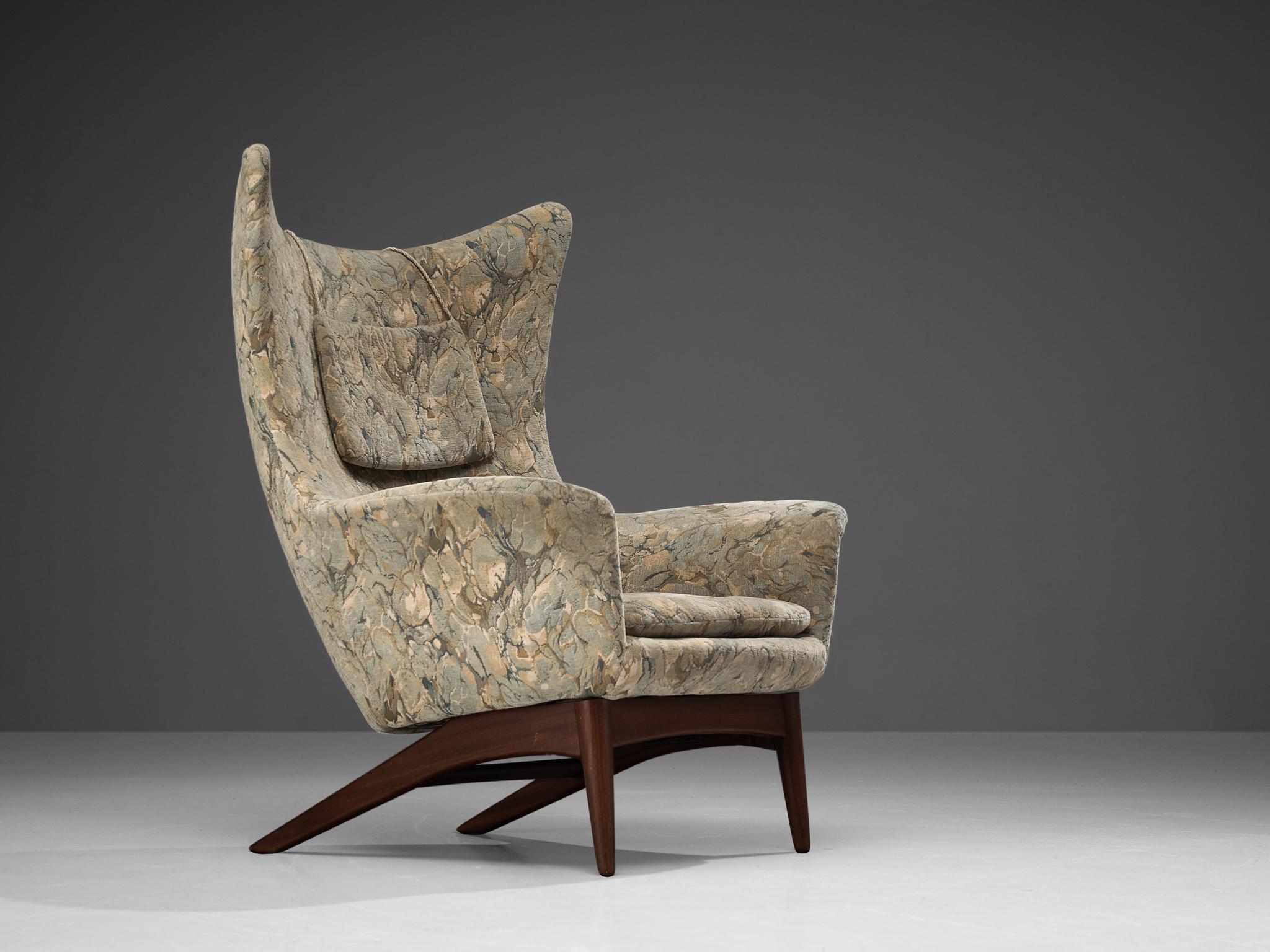 H. W. Klein for Bramin Møbler, wingback chair, model 207, teak, fabric, Denmark, 1950s. 

Sculptural lounge chair by Henry Walter Klein. This wingback chair is a great example of Scandinavian design and comfort. Beautiful organic formed seating,