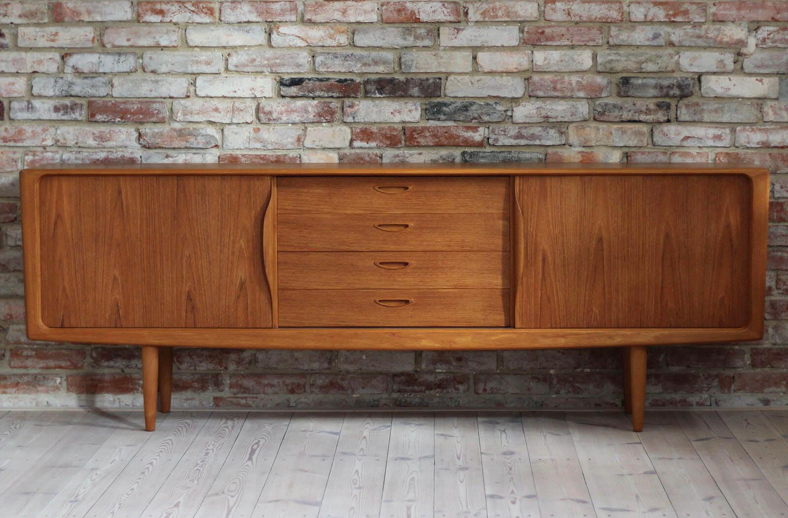This is a quite rare sideboard designed by Norwegian designer Henry Walter Klein. It was manufactured by Bramin Furniture Factory in Denmark around 1960s. The piece features two sliding doors that reveal lots of storage space, each one with a shelf.