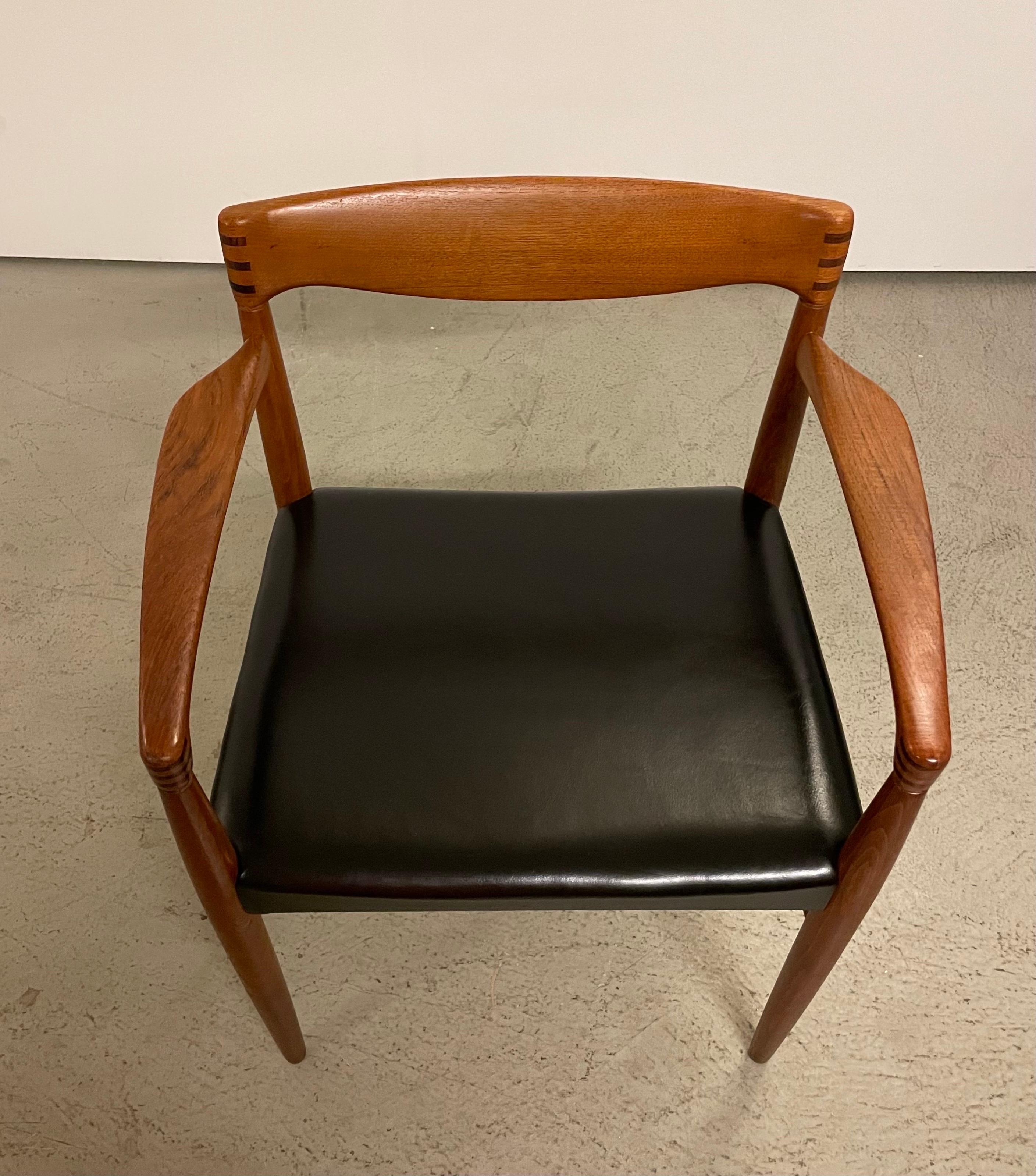 Rare set of teak wooden arm chairs from the 1950s designed by H.W. Klein. Made in Denamrk by Bramin Mobelfabrik. Features a solid teak frame with mortise and tenon backrest and armrests. The chairs are crafted with perfect proportions and attention