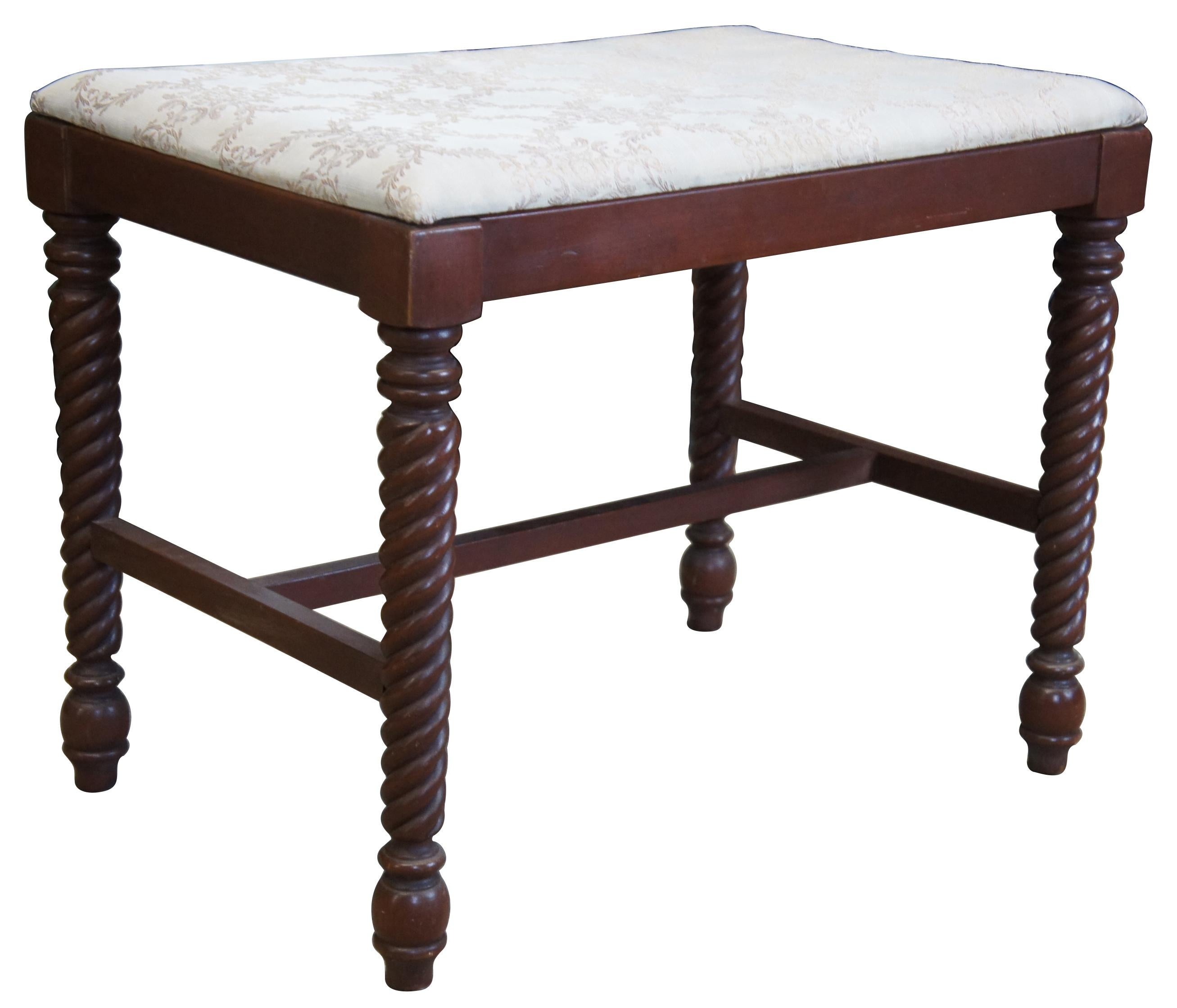 Mid-20th century solid cherry footstool by Consider H. Willett Furniture Co of Kentucky. Rectangular in shape with barley twisted legs connected by an H stretcher. Perfect for use as a piano stool or bench seat. Very similar to Willetts Wildwood