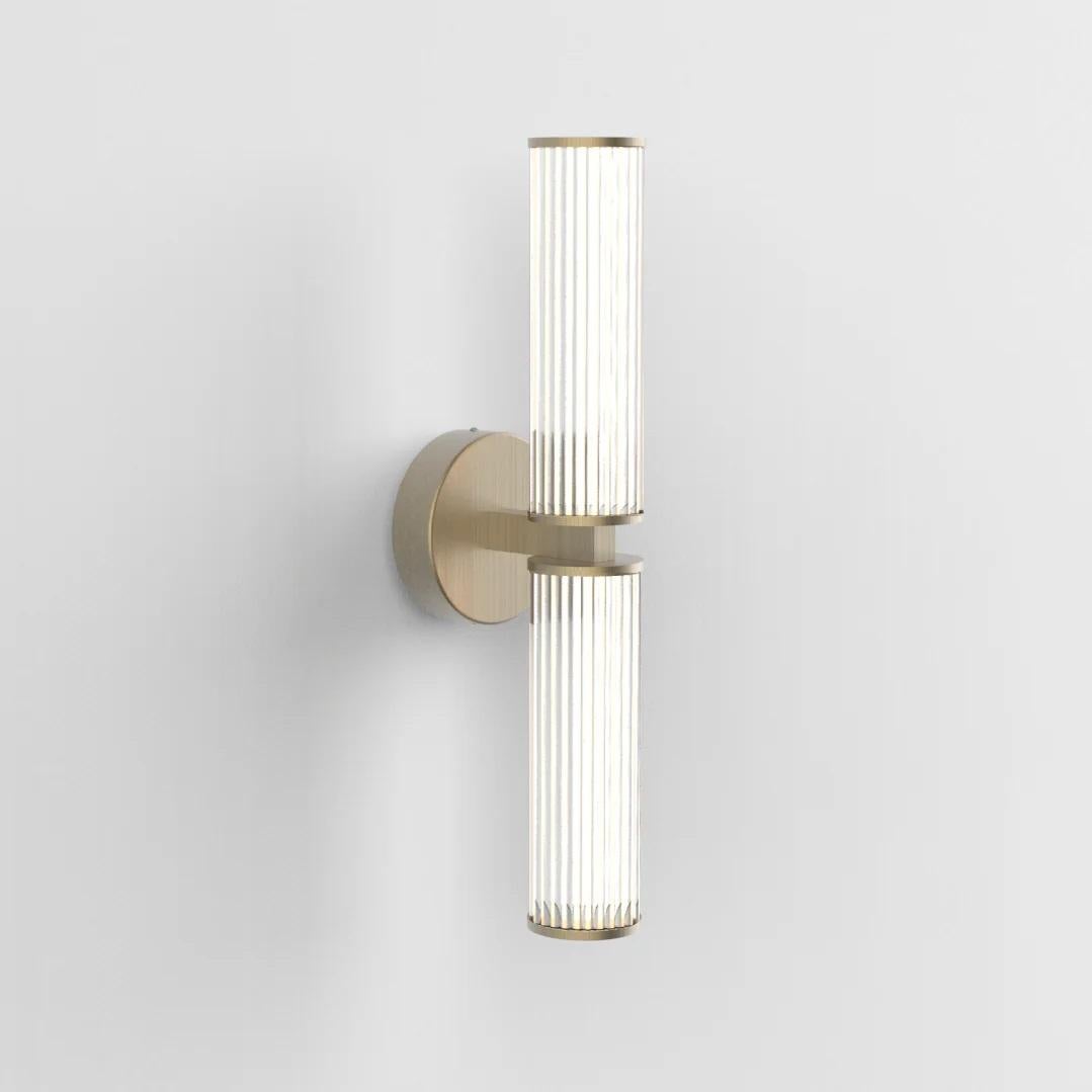 Haara Double Wall Light by Cameron Design House
Dimensions: D 15 x W 12.5 x H 50 cm.
Materials: Brushed brass.

Available in single, double, or branch versions.
Available in different metal finishes. Please contact us.

A double wall light evolution