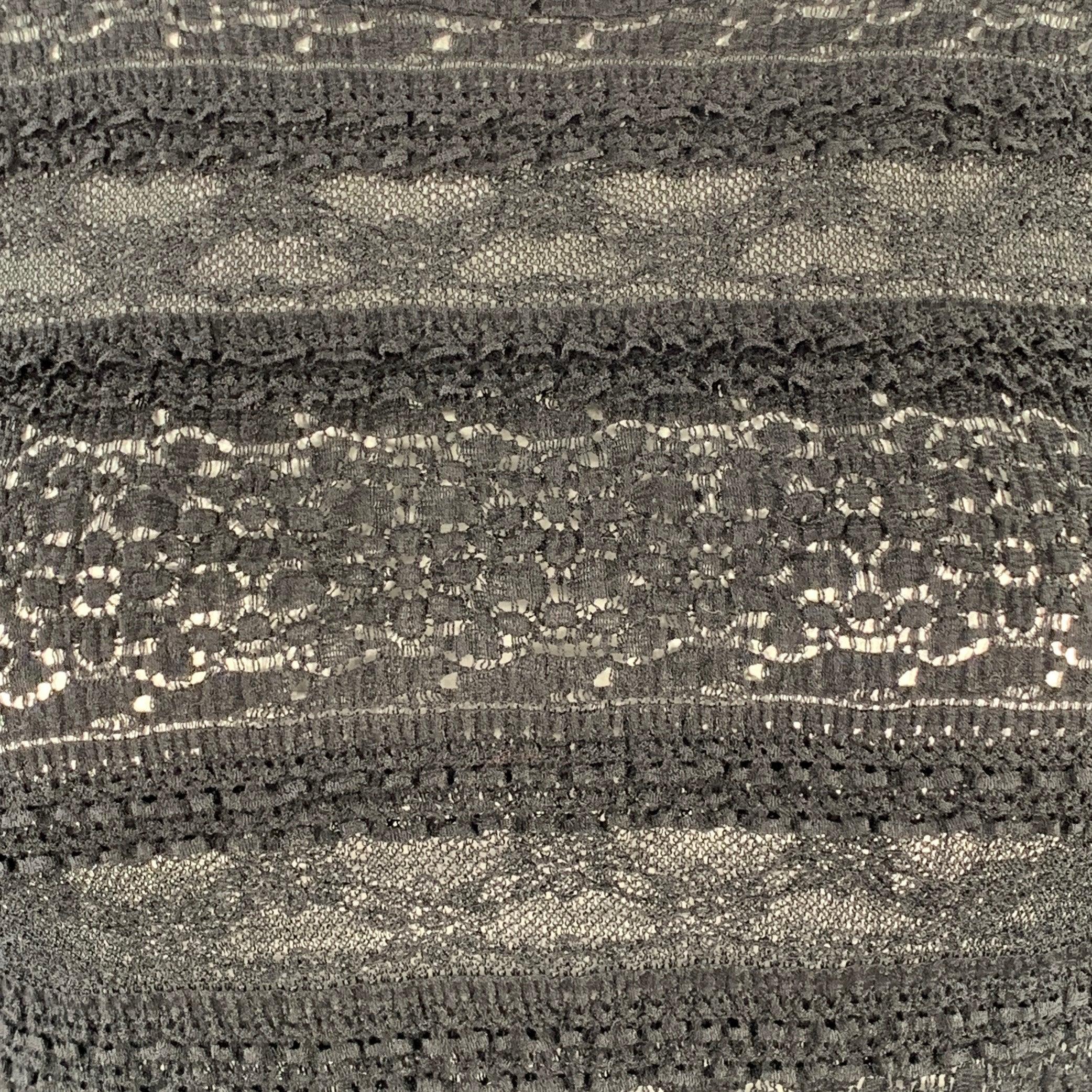 HAAT by ISSEY MIYAKE casual top
in a black cotton featuring a tonal lace stripe pattern made of mixed fabrics, 3/4 sleeves, and round neck. Made in Japan.Very Good Pre-Owned Condition. Minor marks on one sleeve. 

Marked:   JP 3 

Measurements: 
