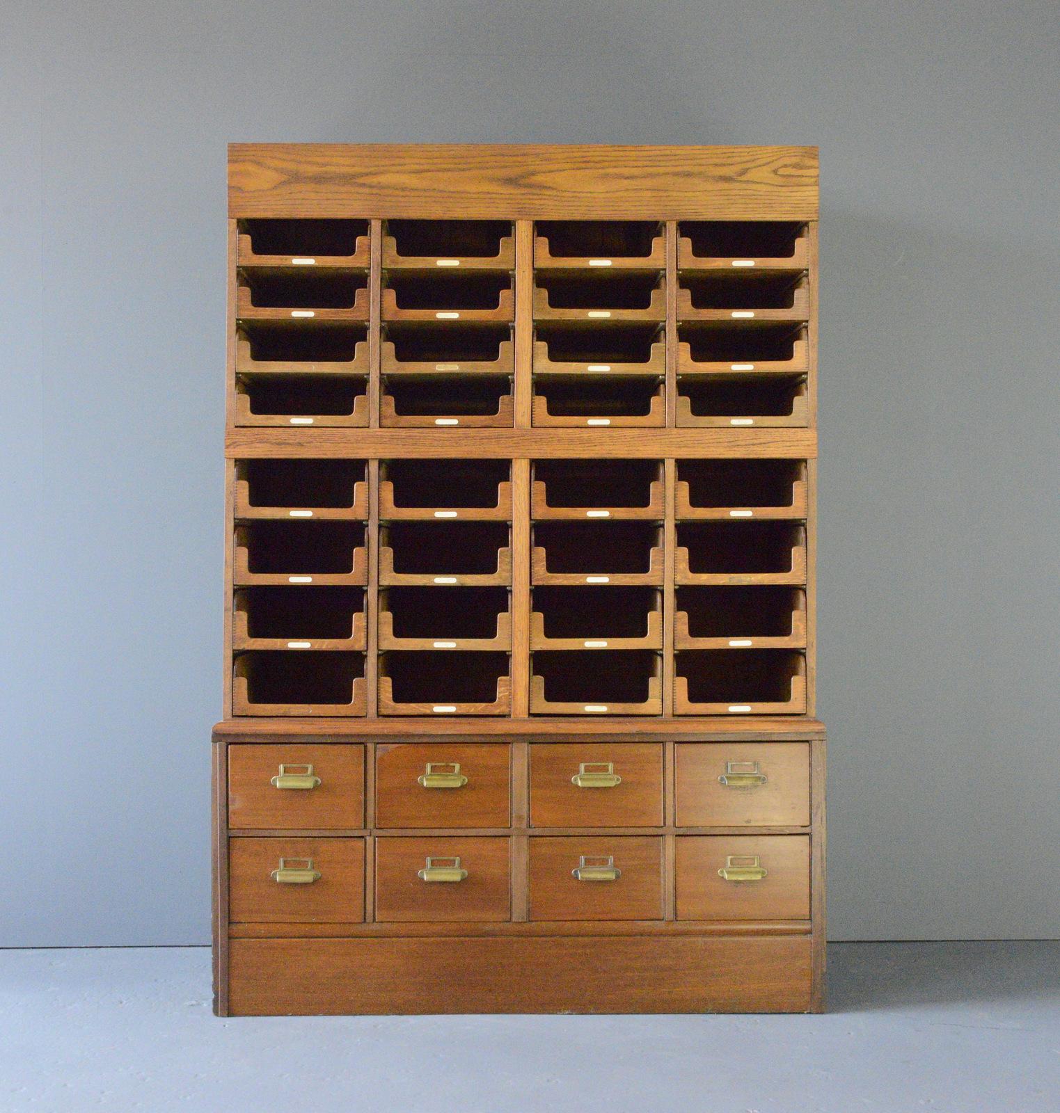 Haberdashery Cabinet By E Pollard & Co circa 1910

- Solid Oak throughout
- Panelled sides
- 32 pullout drawers
- 8 Larger drawers
- English ~ 1910 
- 141cm wide x 207cm tall x 61cm deep

Condition Report

Fully restored, cleaned and