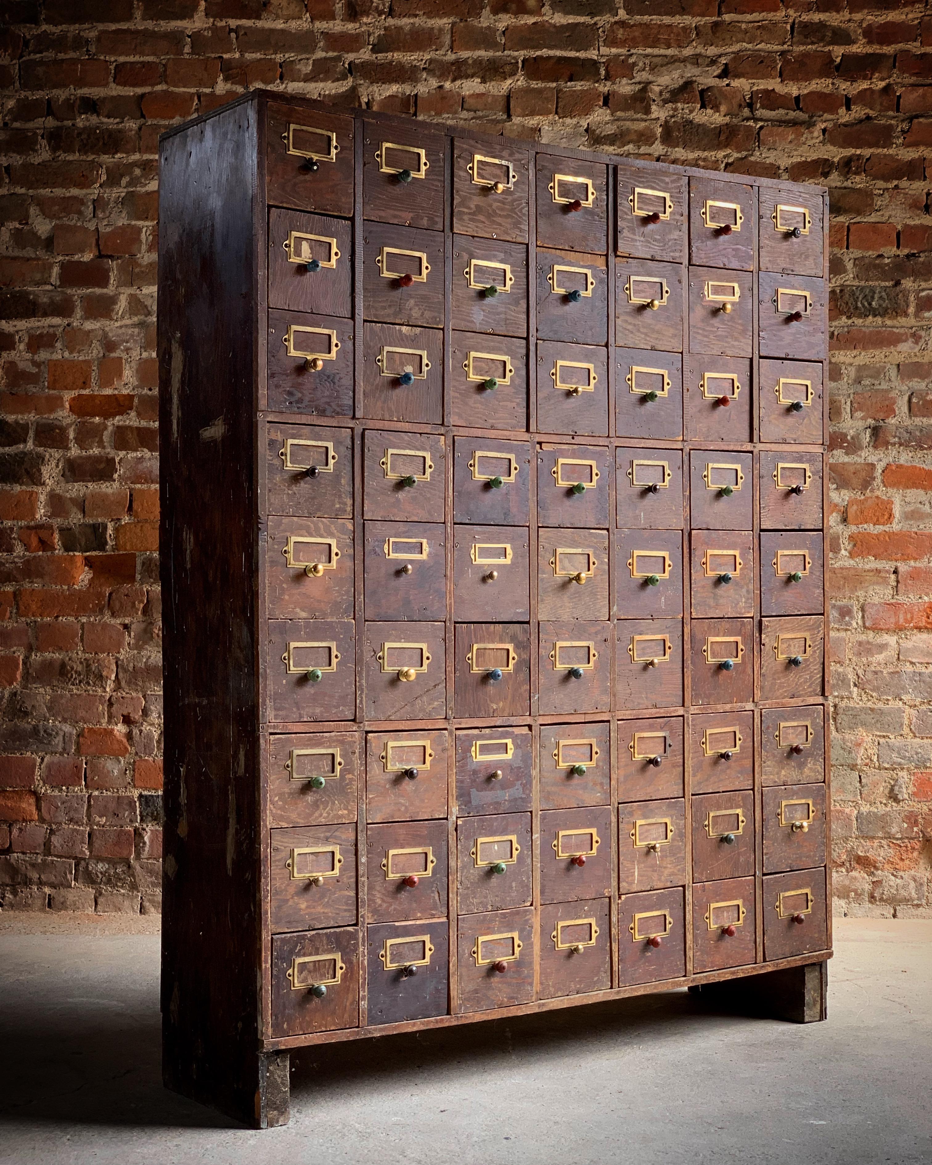 Haberdashery chest of drawers industrial loft style engineers drawers, circa 1940s

Industrial engineers drawers, circa 1940s, tall bank of 72 pull out / pull-out drawers with brass index card holders in original state, perfect patina, very