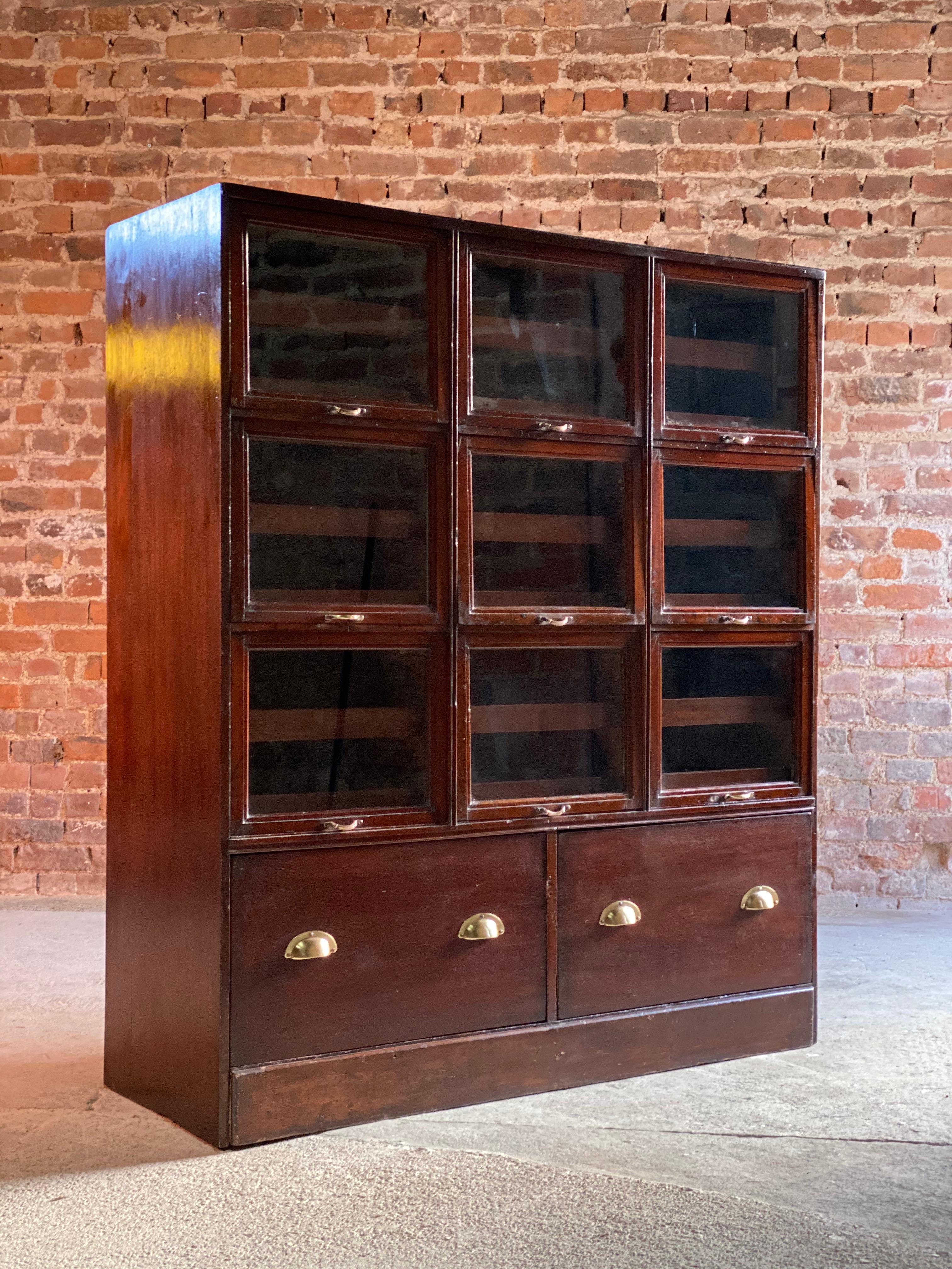 Haberdashery drapers shop display cabinet mahogany loft style, circa 1940

W are delighted to this magnificent early 20th century British mahogany haberdashery drapers display cabinet circa 1940, the rectangular top over nine 'up and over' glass