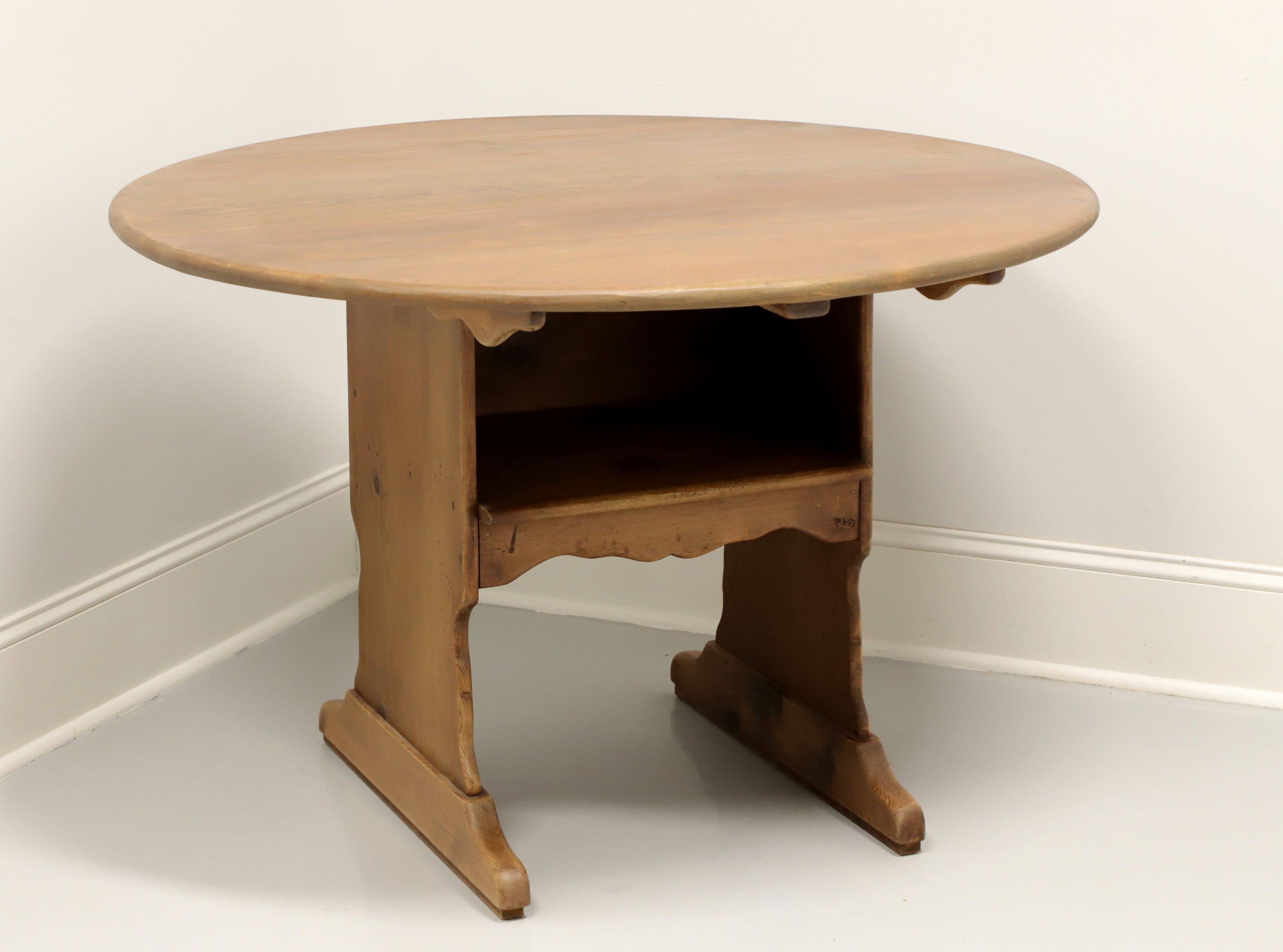 A Rustic style round tilt-top hutch dining table by Habersham Plantation, of Clarksville, Georgia, USA. Solid pine with chair-like pedestal base. Features tilt-top that flips back on wood pegs behind the pedestal base giving the appearance and use