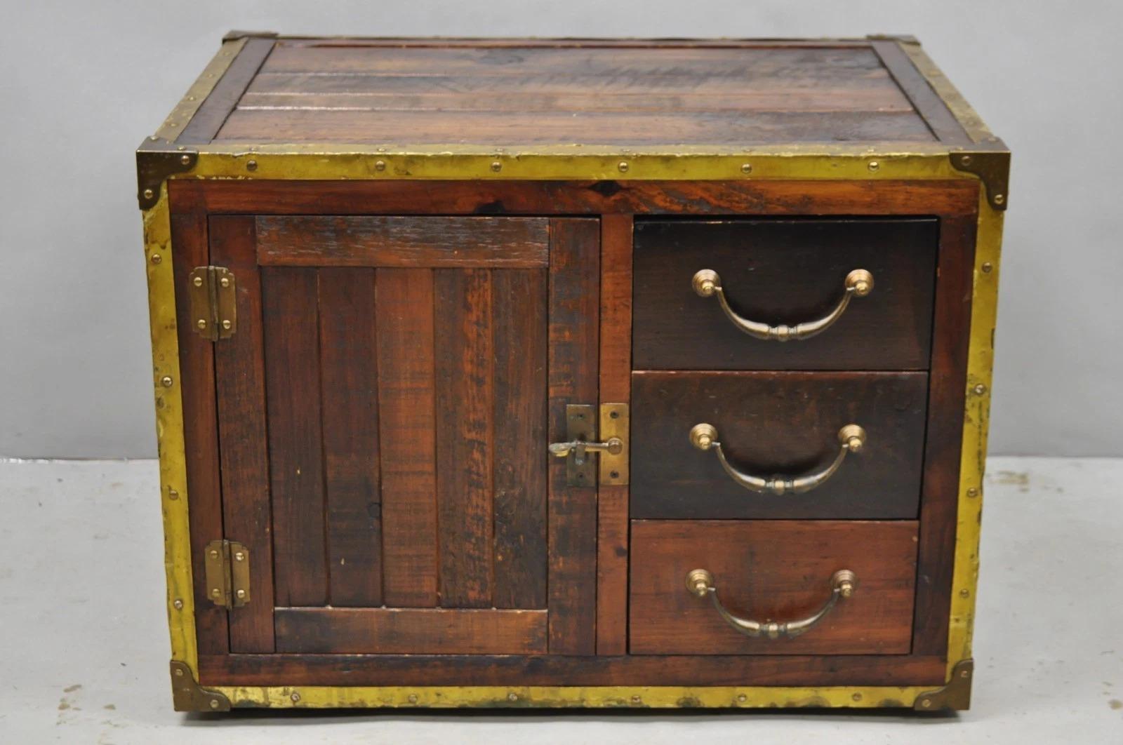 Habersham Wooden Plantation Campaign Trunk Style Small Coffee Table/Side Table with Brass Trim, Distressed Finish, 3 Drawers, and Swing Door. Circa Late 20th Century. Measurements: 21