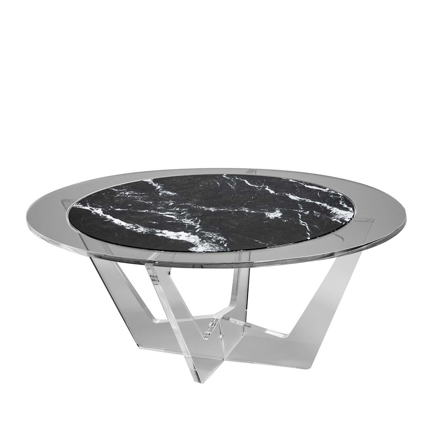 The essential lines of this modern table embody the perfect balance between the lightness and transparency of the methacrylate and the stern austerity of the marble. Seemingly afloat a smoke-gray acrylic glass ring, the oval Carnico marble top