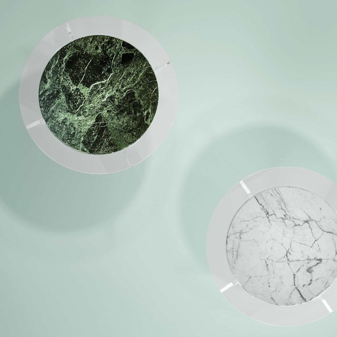 An exquisite Green Alps marble atop a crossed methacrylate base are the components of this original design that effortlessly merges solidity and transparency, modern and classic materials to become the eye-catching focal point in a modern living