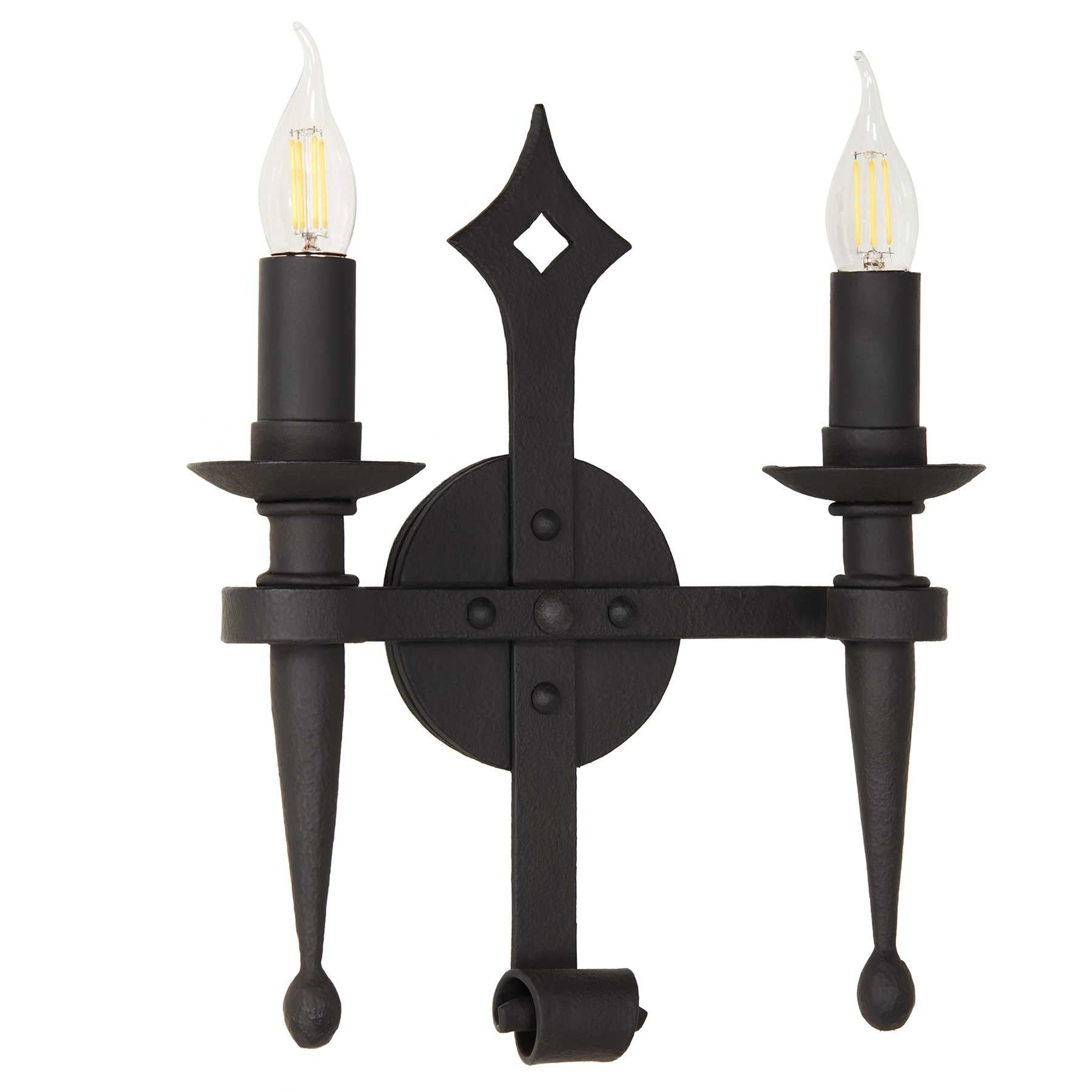 This wrought iron wall mount fixture has a classic French influence, with simple scrolls and a diamond motif on the backplate.  A perfect sconce for many architectural styles, including Spanish Hacienda, Mediterranean Villa and French Colonial. 