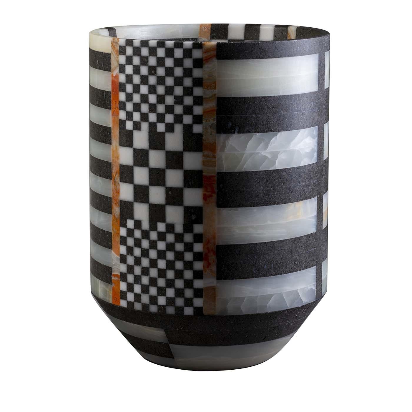 The checkerboard and striped effect showcased by this superb vase requires complex technical skills to compose the geometric shapes on a curved surface. Carefully cut pieces of basalt, green onyx, rainbow onyx, and white Sivec marble are selected,