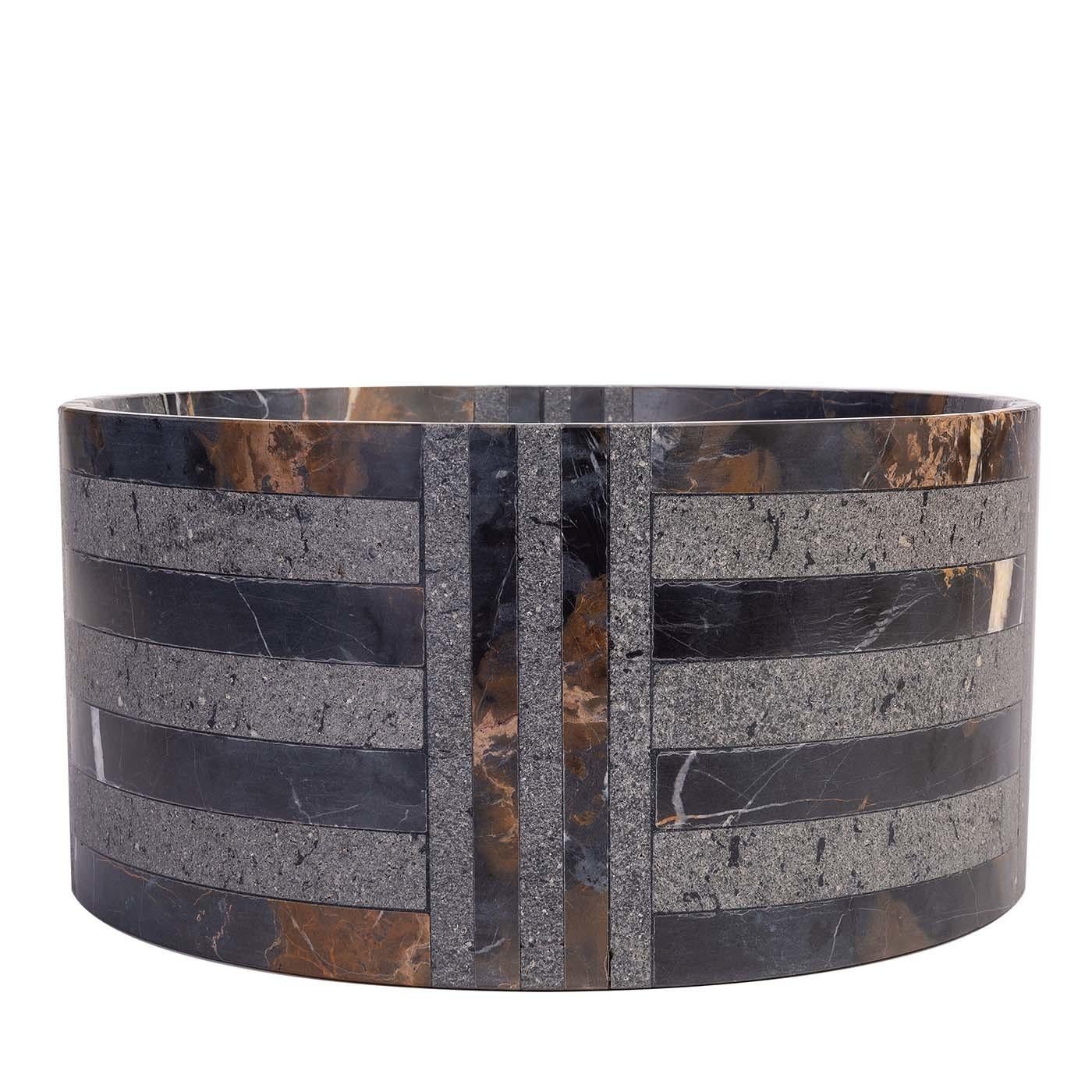 A striking mix of striped and checkerboard patterns grace this superb bowl of the Hacker collection by Paolo De Vivo. Entirely handcrafted of basalt, the hypnotic combination of deep black and gold-speckled fine-grained textures infuse this piece