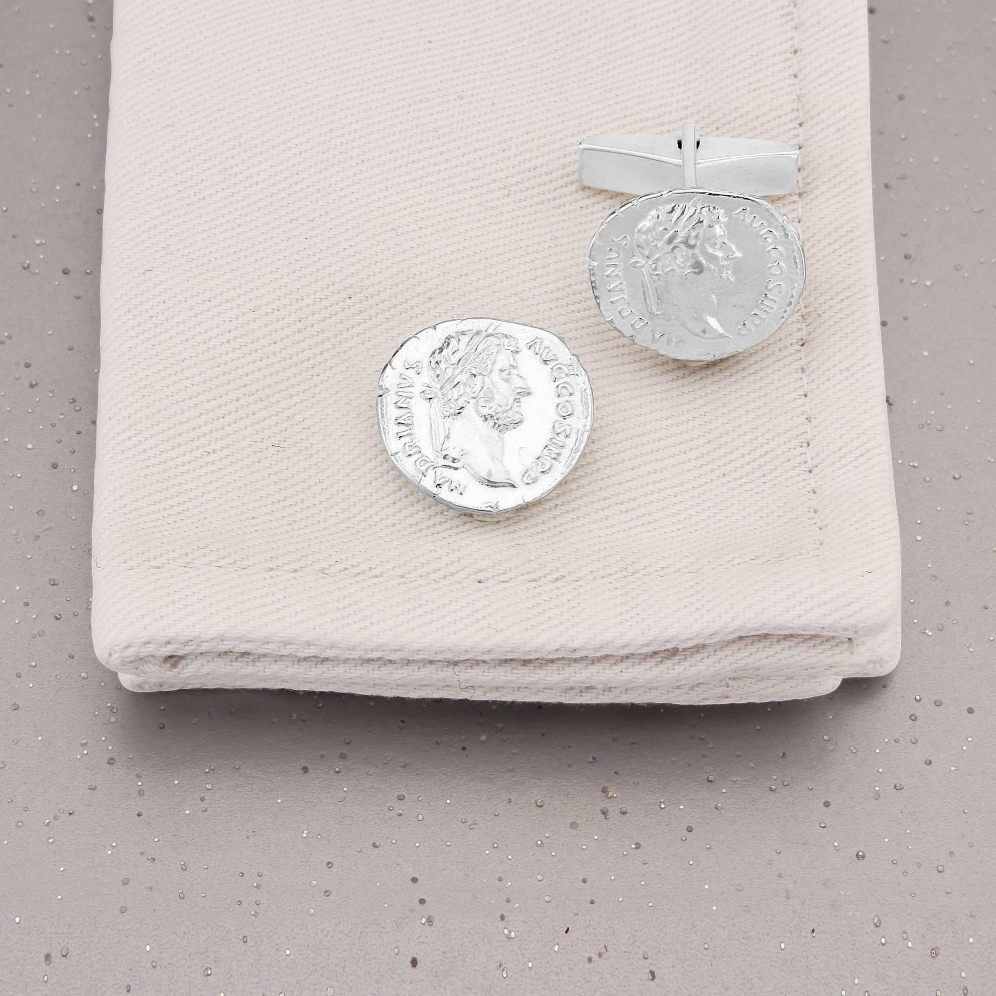 Roman History on your cuffs! Stunning replica of an ancient original coin featuring Emperor Hadrian, in Sterling Silver.
This interesting design is taken from an old Roman coin which was found in Jerusalem. Simon Kemp carefully took a mould of the
