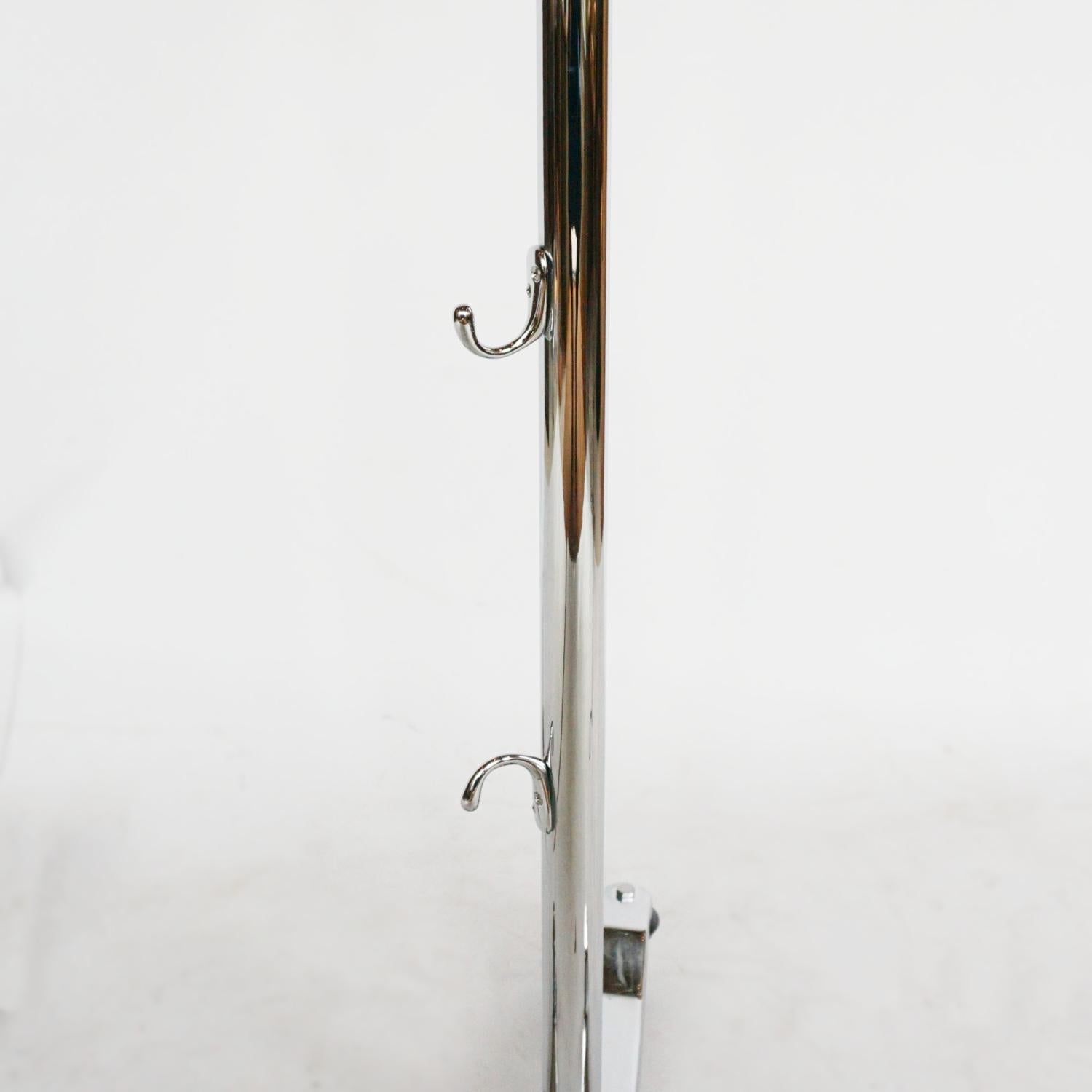A rare Horstmann roller trolley lamp. Earlier prototype/model. Original components with original trolley and wheels. Chromed metal, stamped Horstmann to roller mechanism. 

Dimensions: H 212cm fully extended. W/D of base 43cm 

Origin: