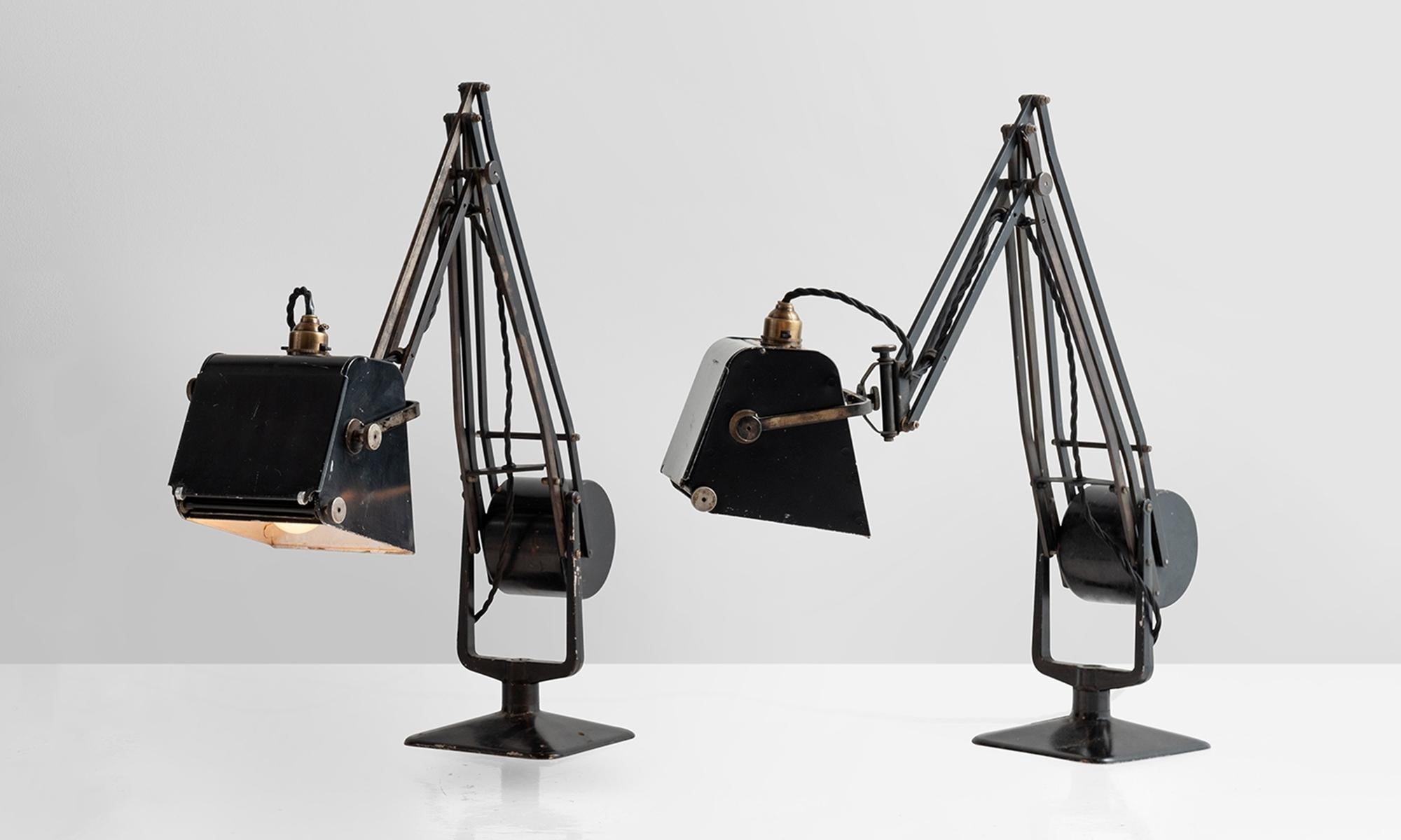 Magnifying work lamp in original black finish with weighted counterbalance. Each lamp has the original makers mark in tact.
  
   