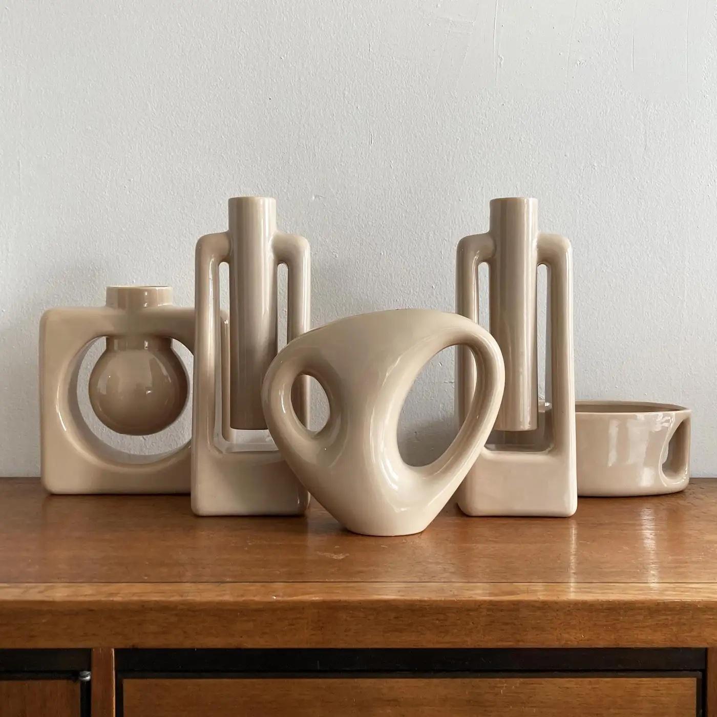 A stunning and rare abstract midcentury style Haeger beige/ ecru vase, medium size. This vase coordinates with three other matching vases, listed separately, see photos. Beautiful as a pair, or grouped with tonal pieces to form a larger set. This
