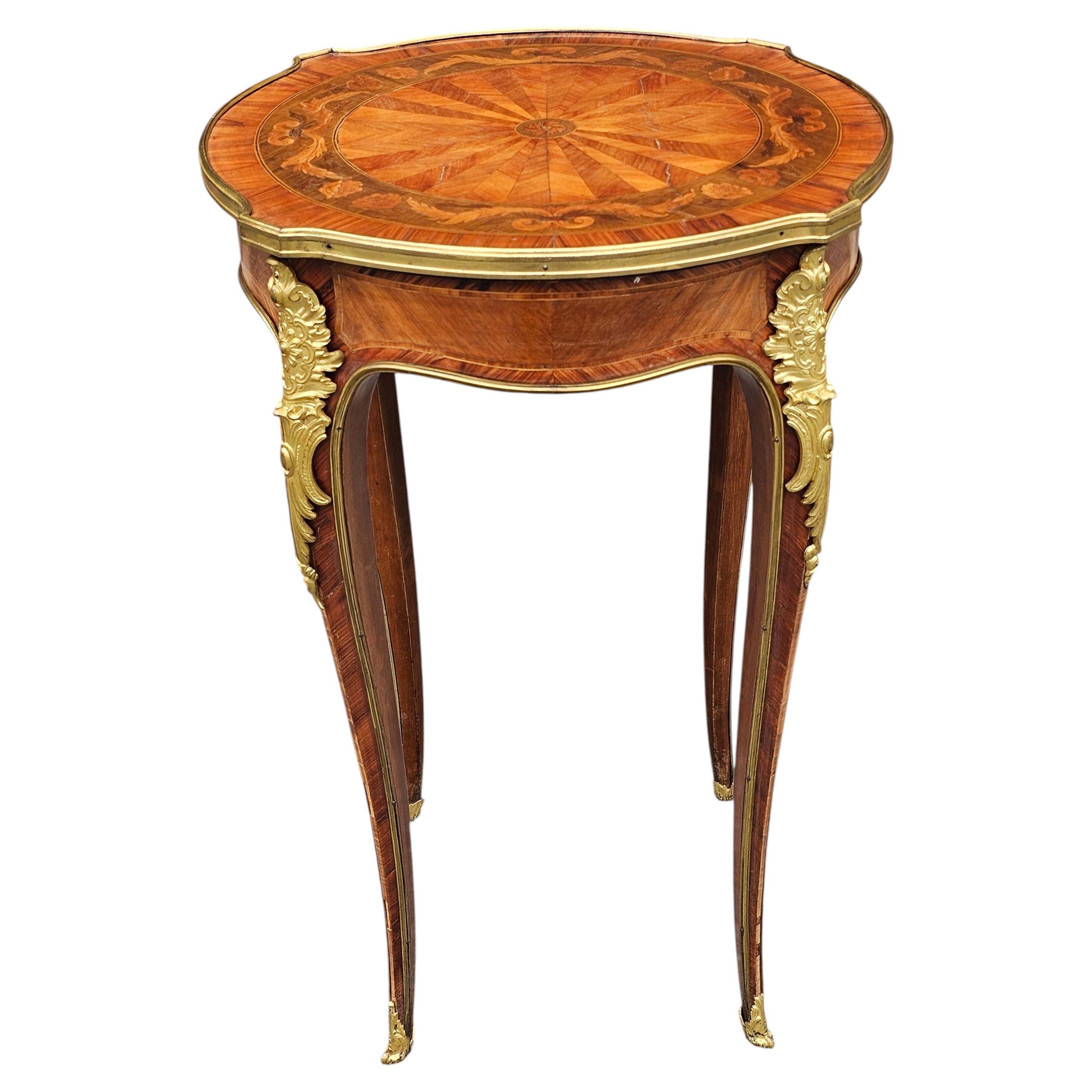 Gueridón atribuido a Haentges Freres de bronce dorado y madera de rey. París, hacia 1890 en venta
