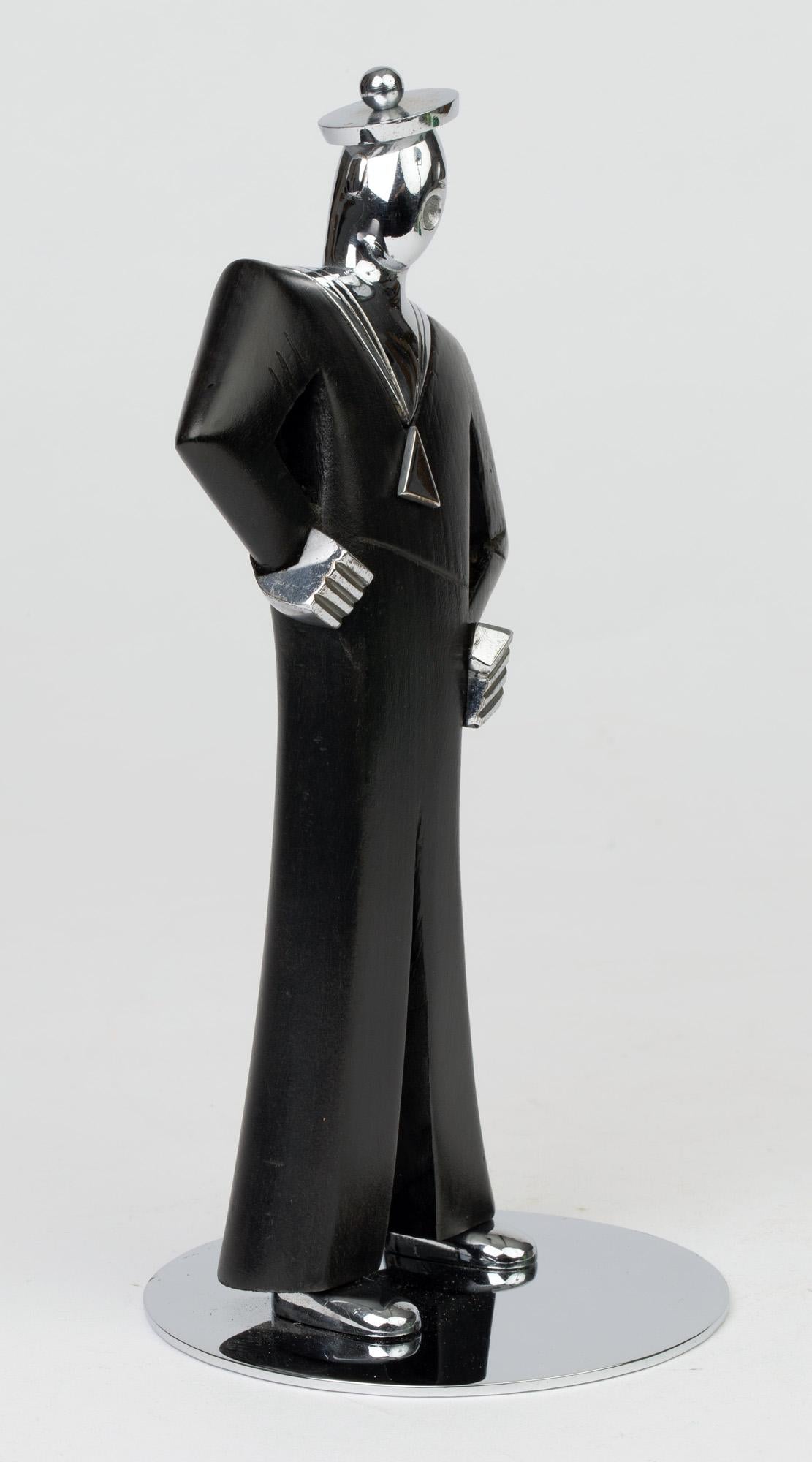 A delightful Austrian Art Deco stylized figure of a jolly sailor by Hagenauer and dating from circa 1930. The figure made combining chrome and ebonized wood stands on a wide rounded chrome base and stands with his hands on his waist and mouth open