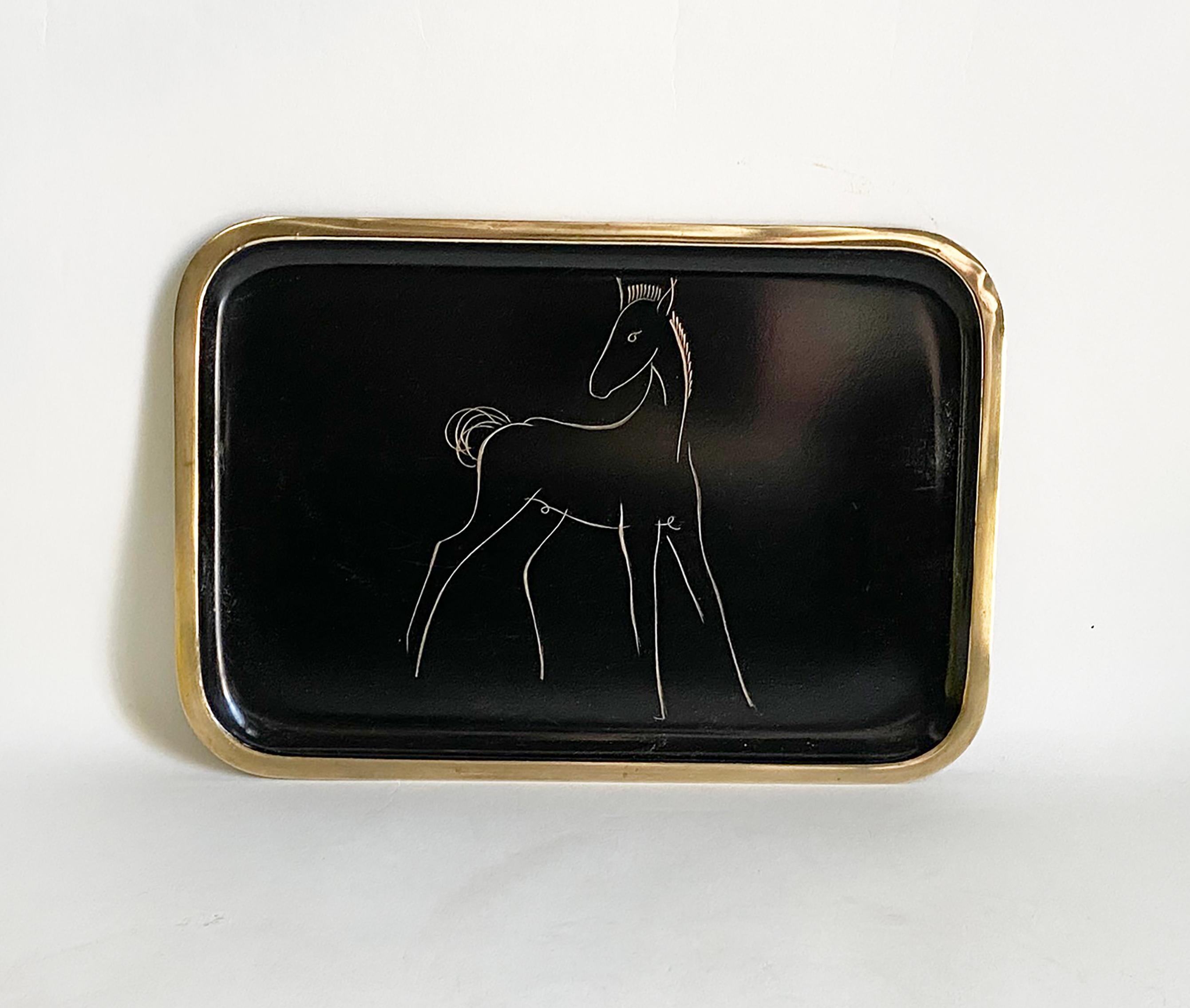 Here is a very sweet and unusual tray be Hagenauer of Austria from the mid-20th century. The tray is crafted of brass and then enameled in black. A charming foal is etching into the enamel. The tray is stamped handmade and well-marked with the