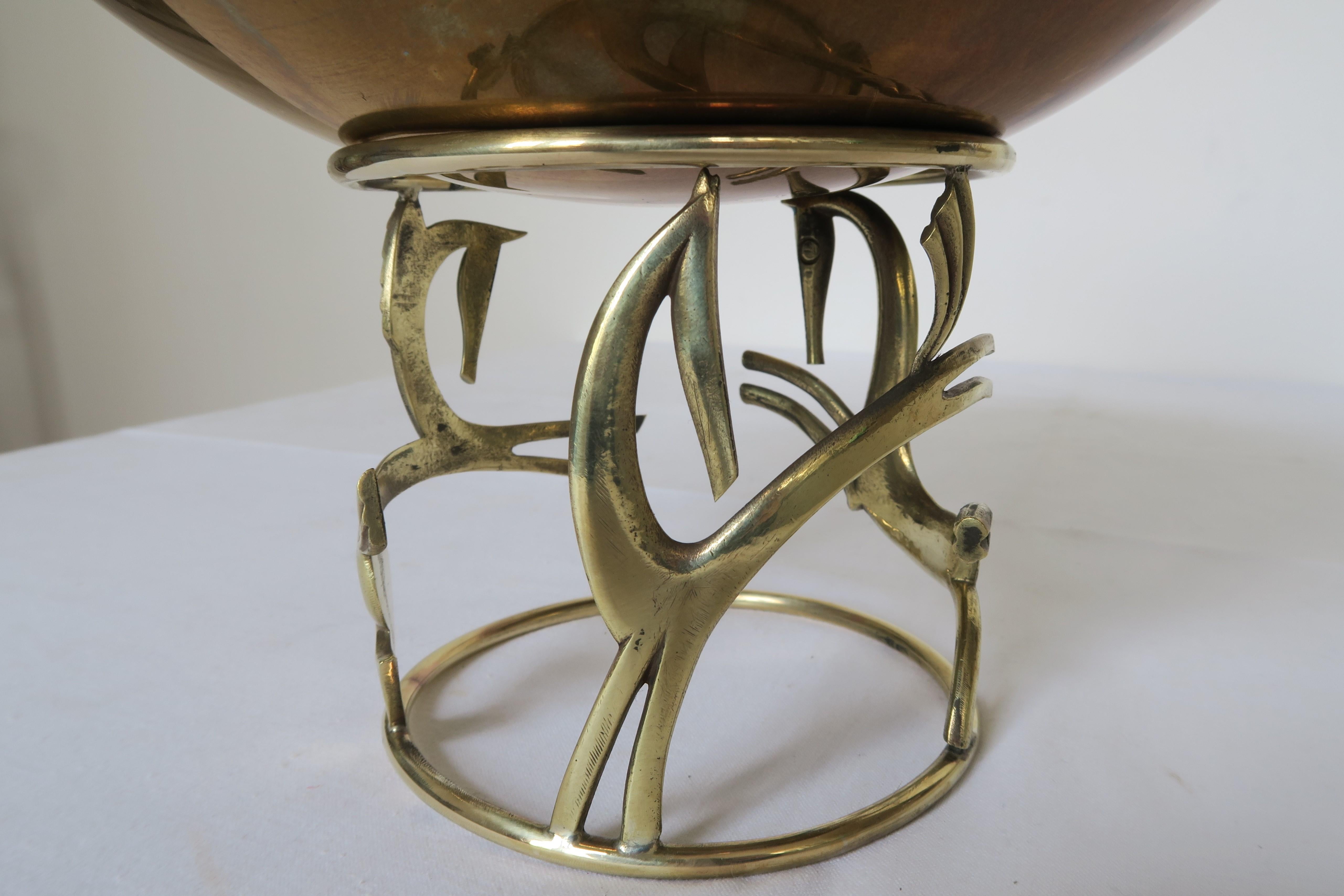 In this ad you find a fine example of Art Nouveau design. For sale is a beautiful brass bowl designed and manufactured by the renowned Wiener Werkstätte Hagenauer. The base is embellished with stylized horse ornaments that are dynamically roaming