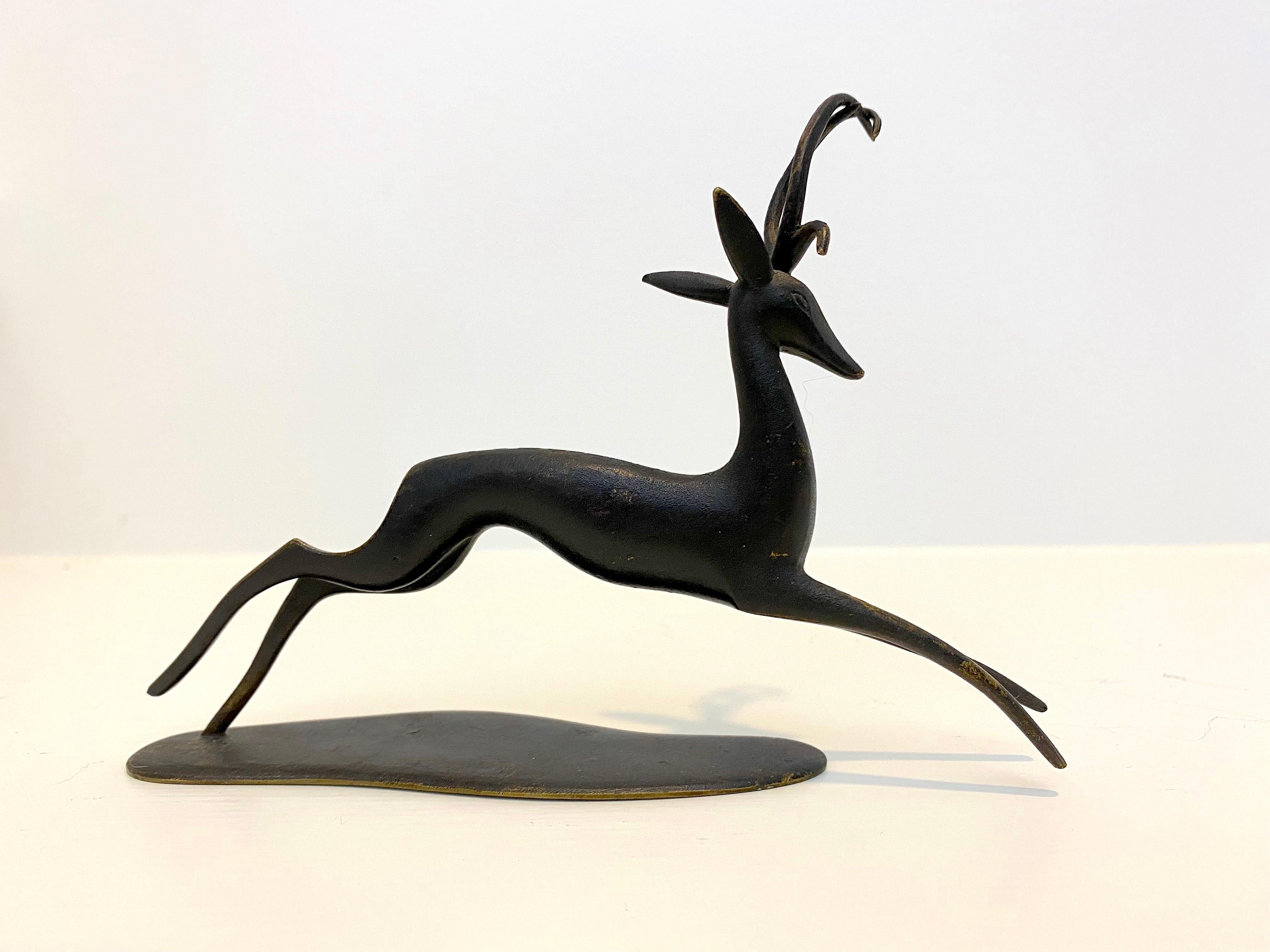 Fabulous and Fun Hagenauer patinated bronze Deer sculpture that is a great piece of art for it's size. 
Signed, Hagenauer, WHW, Handmade, Made in Austria.