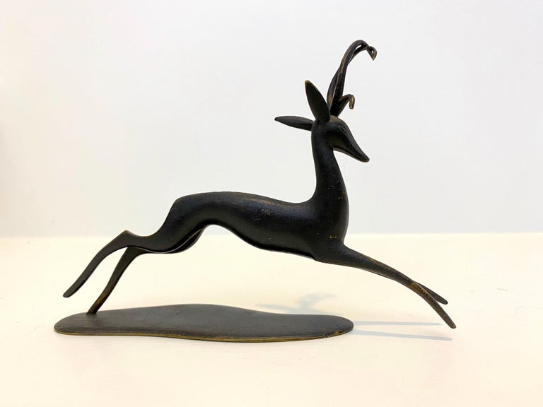 Fabulous and Fun Hagenauer patinated bronze Deer sculpture that is a great piece of art for it's size. 
Signed, Hagenauer, WHW, Handmade, Made in Austria.