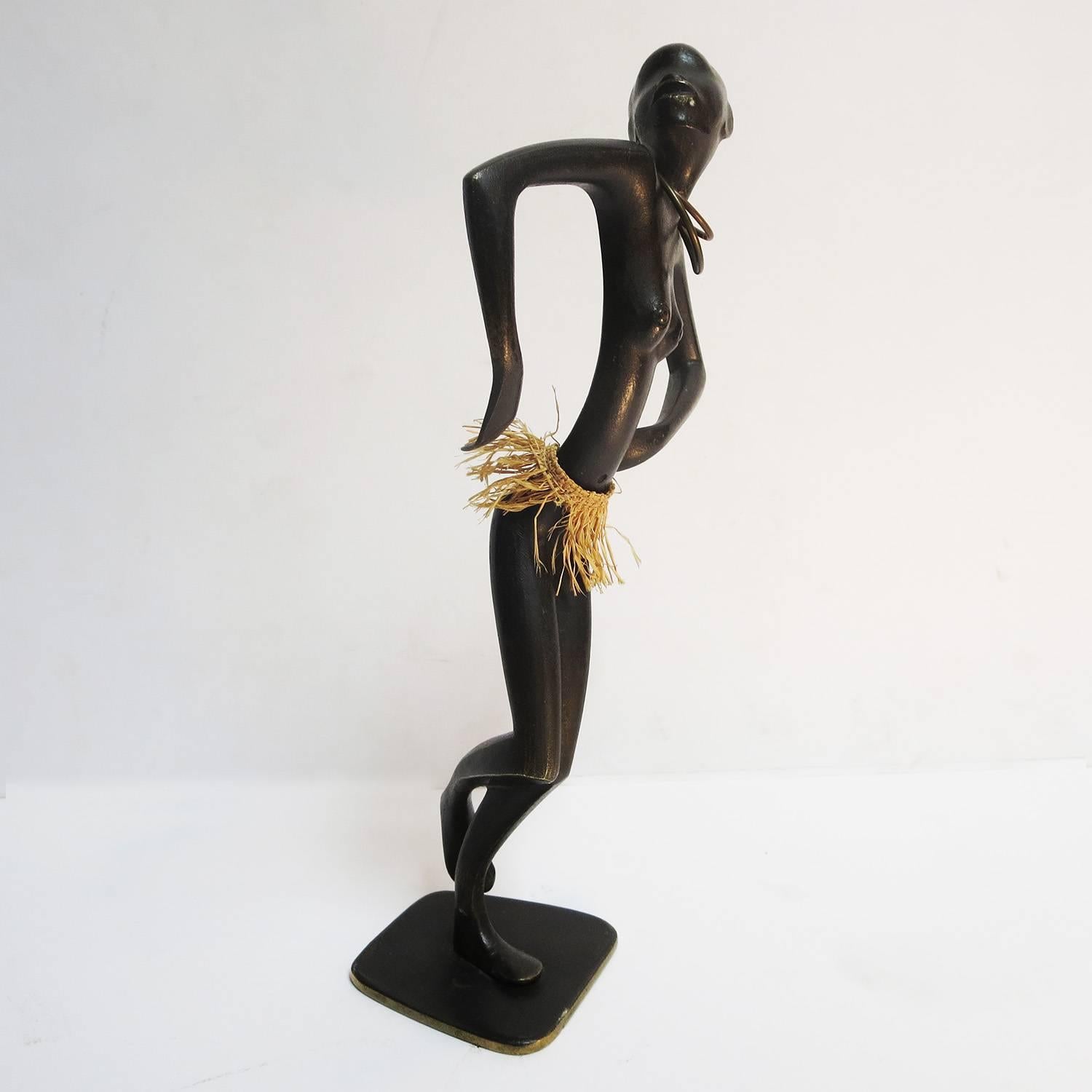 During the Art Deco period of the 1930s, the European designers were greatly influenced by African culture and design. Karl Hagenauer was no exception, and employed African references freely in his works. This dancing woman is a classic example of