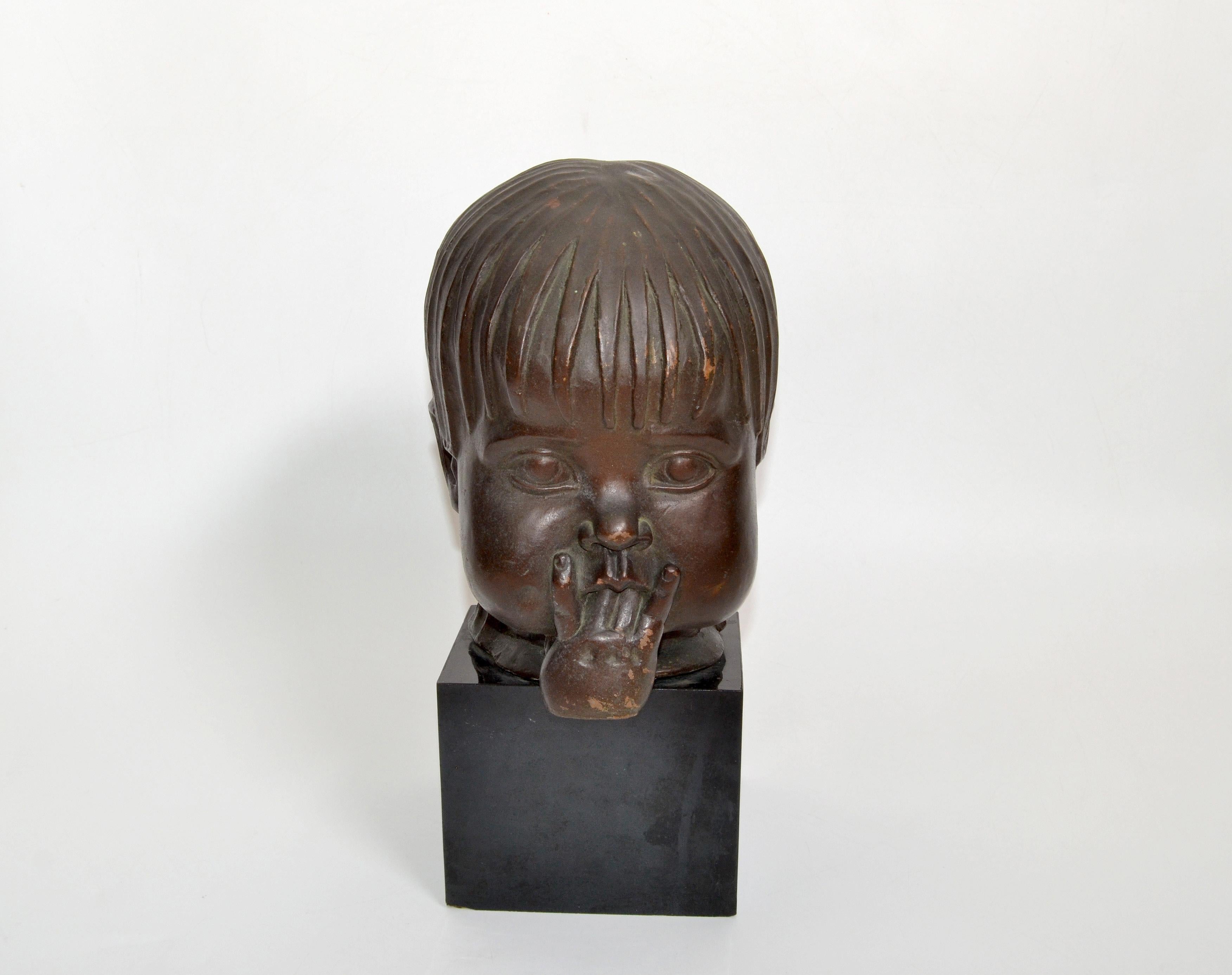 Art Deco style manner of Franz Hagenauer terra cotta bust of a little girl's head sucking on her fingers.
No signature found.
Made circa 1940s.
  