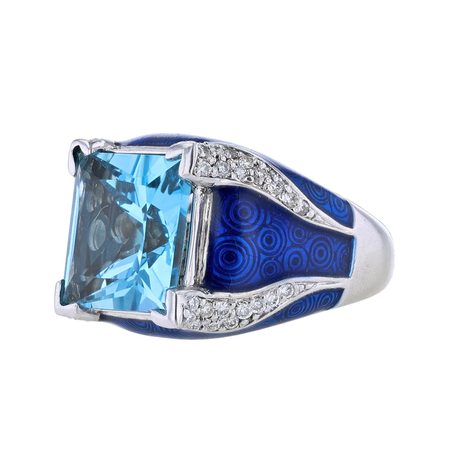 This ring is made in blue enamel and 14K white gold. With a princess cut 11.56 carat blue topaz and 0.50 carat round cut diamonds.  
