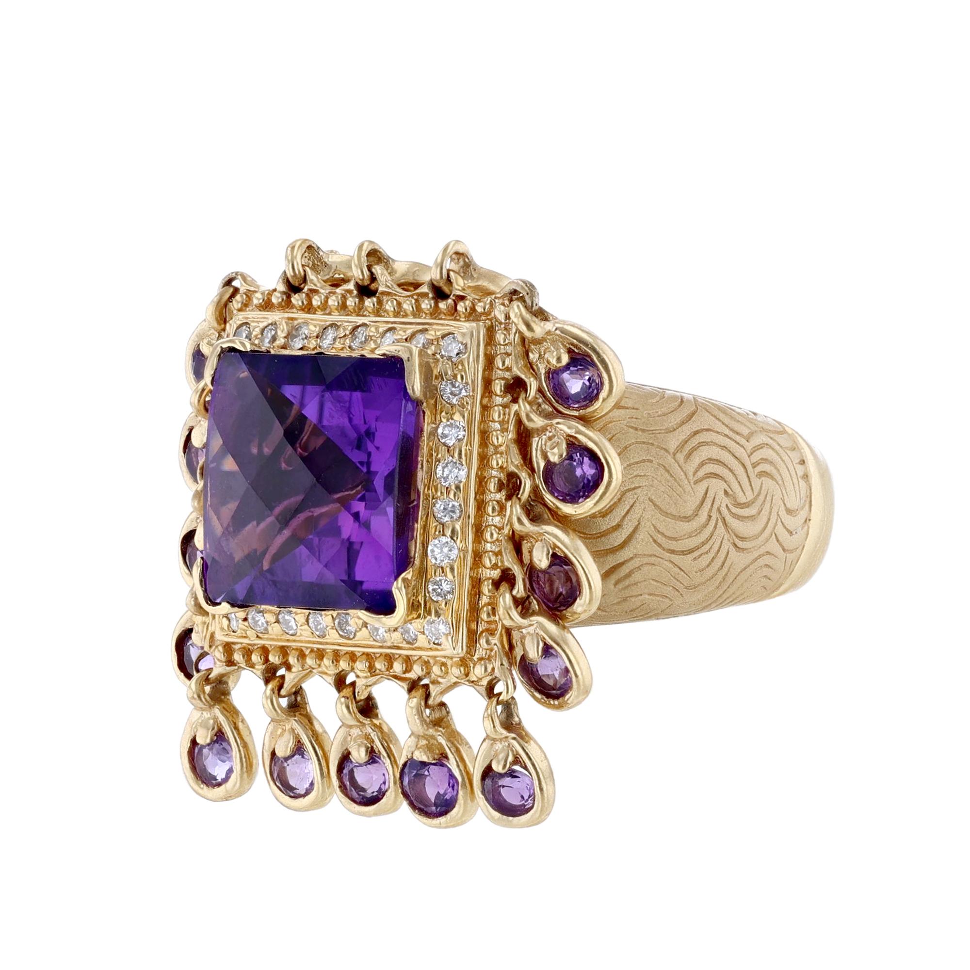 This ring is made in 14K yellow gold. With a princess cut amethyst, 0.28 carat round cut diamonds, and amethyst charms. The total carat weight of amethyst is 5.41 carat.


