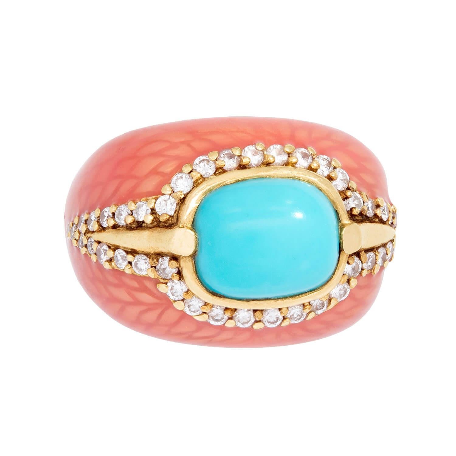 Uno squisito e sostanzioso anello vintage (anni '60 circa) del designer di gioielli Haggai! Realizzato in oro giallo 14k, il centro dell'anello presenta un grande turchese cabochon incastonato in un castone. Il turchese è circondato da un bordo di