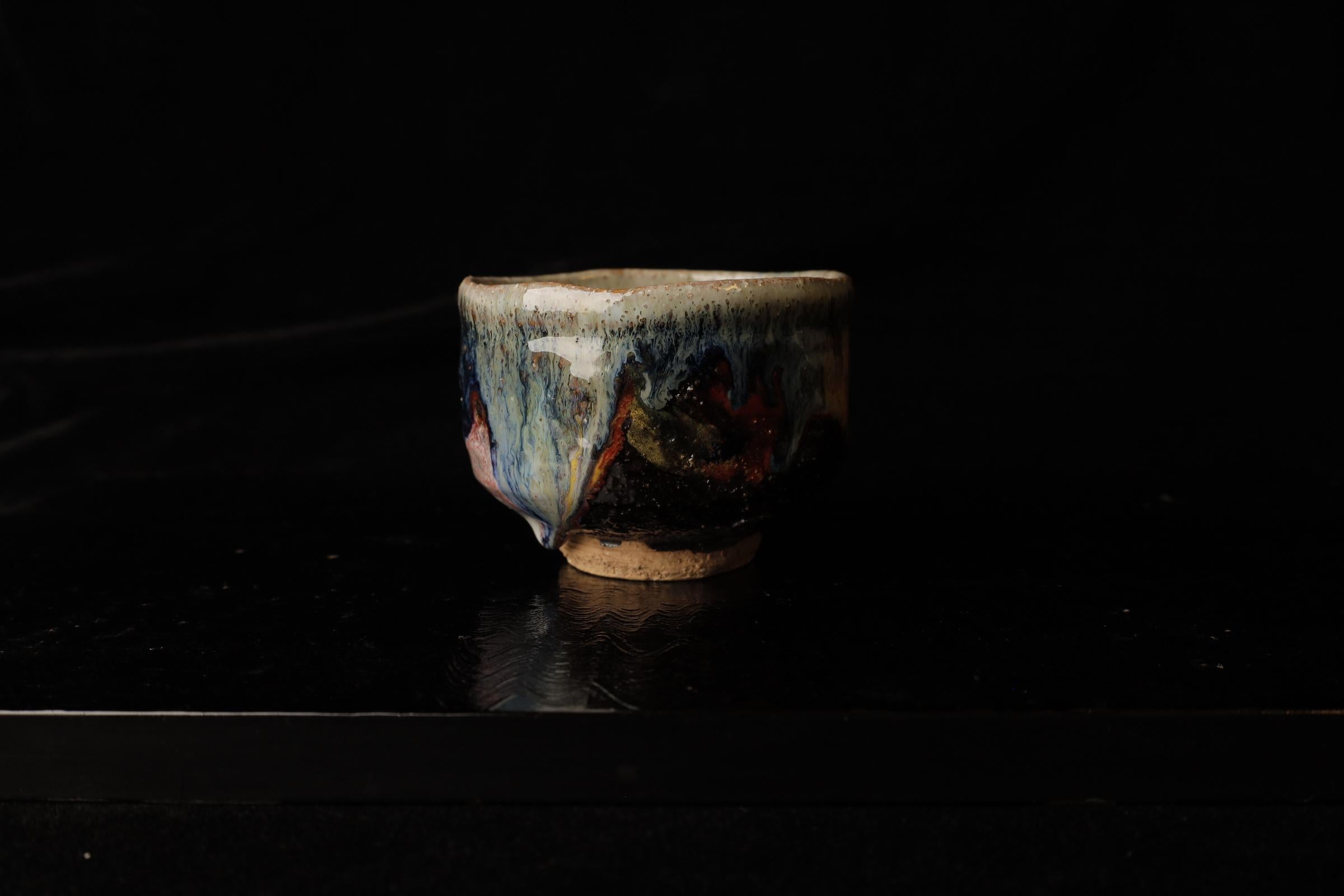 This exquisite Japanese tea bowl is a prime example of Hagi Ware, crafted by renowned potter Seigan Yamane. Known for his innovative approach to traditional Hagi pottery, Yamane’s work is celebrated for its unique texture and meticulous