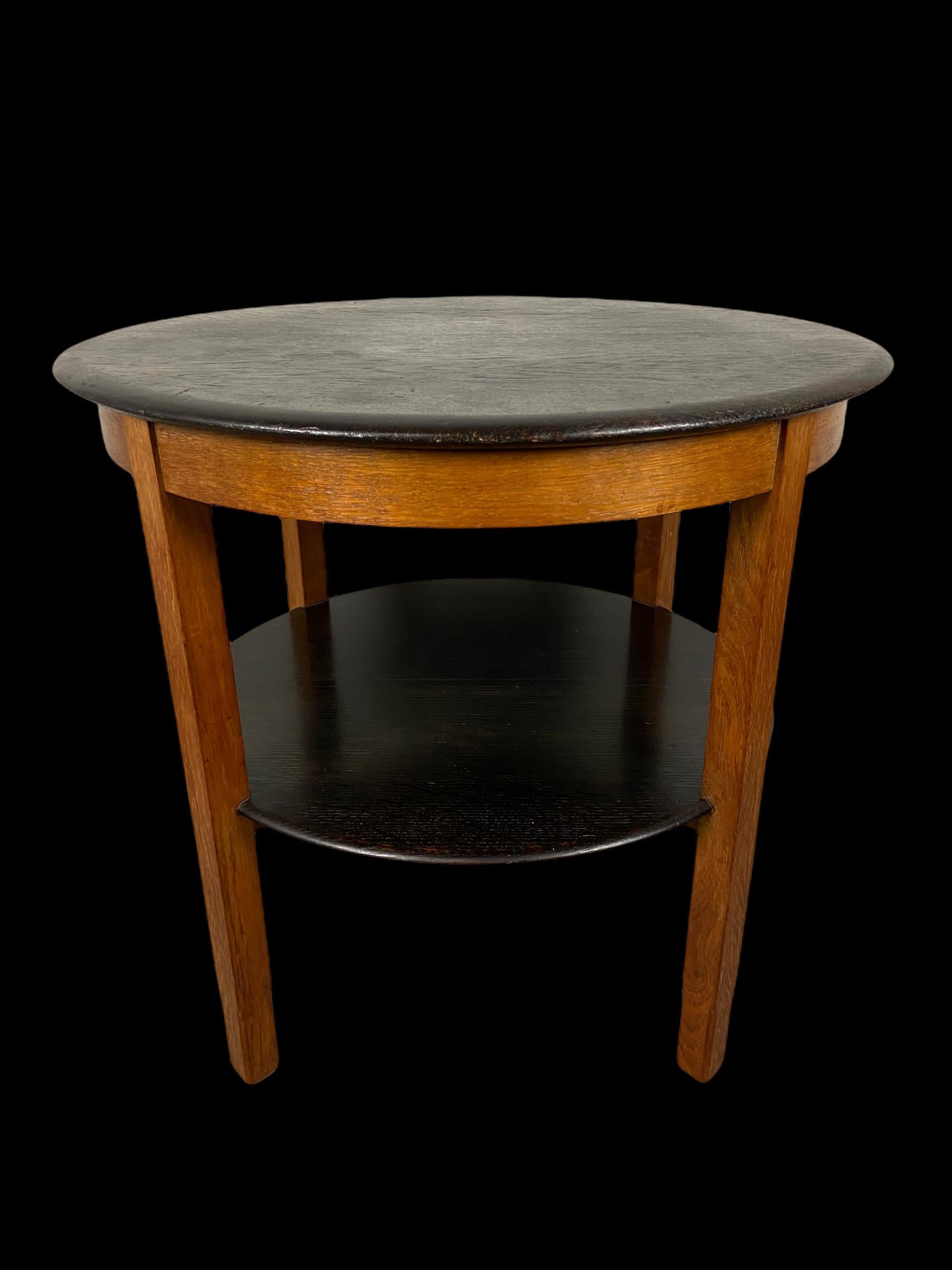 Hague School coffee table made of oak by the firm ” LOV Oosterbeek” around 1920. The furniture factory L.O.V Oosterbeek(Labor Omnia Vincit; Work conquers all)was established in 1910 and was important in the history of Dutch applied art. Dutch design