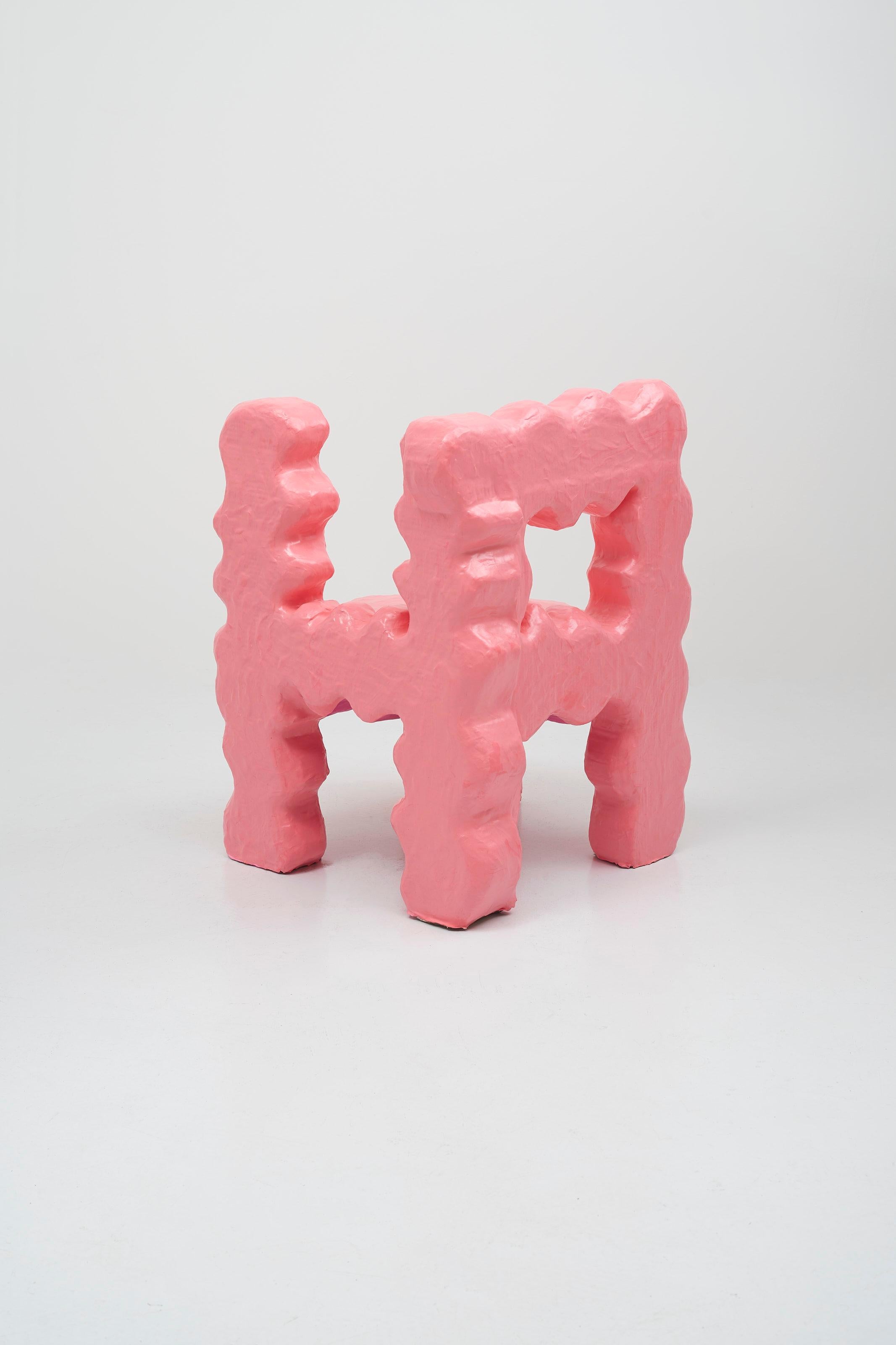 Haha Chair made in brightly coloured clay, designed in a bid to inject some fun into daily and common objects. 

The shape of the chair is made by Dutch artist Hugo Beheregaray to look like 'HA' !
It is recovered by Diego Faivre's playdouch to