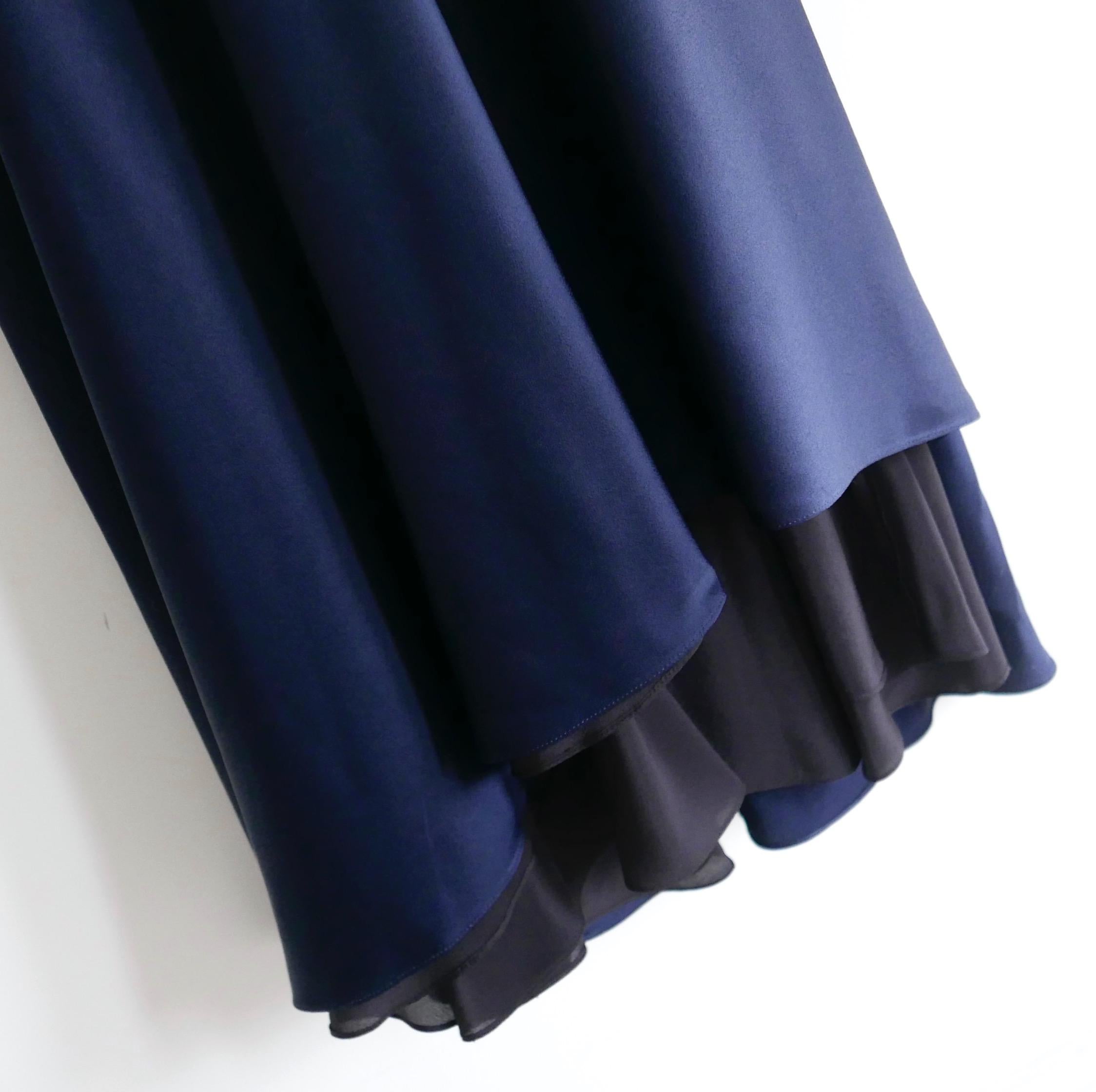 Dramatic, modern minimalist Haider Ackerman navy satin gown. Bought for £1750 and new with tag. Made from shiny indigo acetate mix satin with a black silk lining. Superbly tailored with a sweeping bias cut graduating into a floor sweeping,