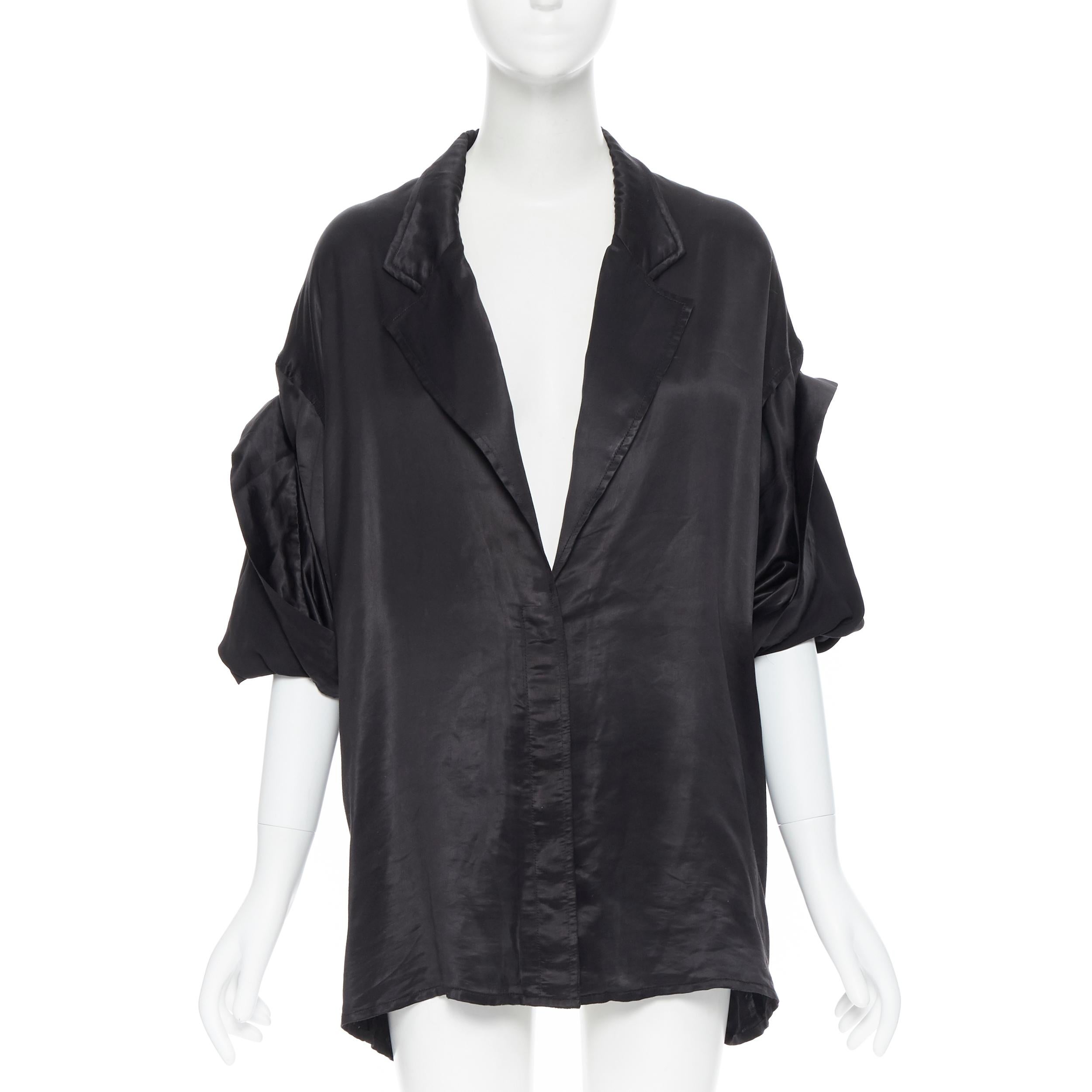 HAIDER ACKERMANN 100% polyester black wide drape sleeve button kimono shirt FR38
Brand: Haider Ackermann
Designer: Haider Ackermann
Model Name / Style: Kimono shirt
Material: Polyester
Color: Black
Pattern: Solid
Extra Detail: Wide collar. Single