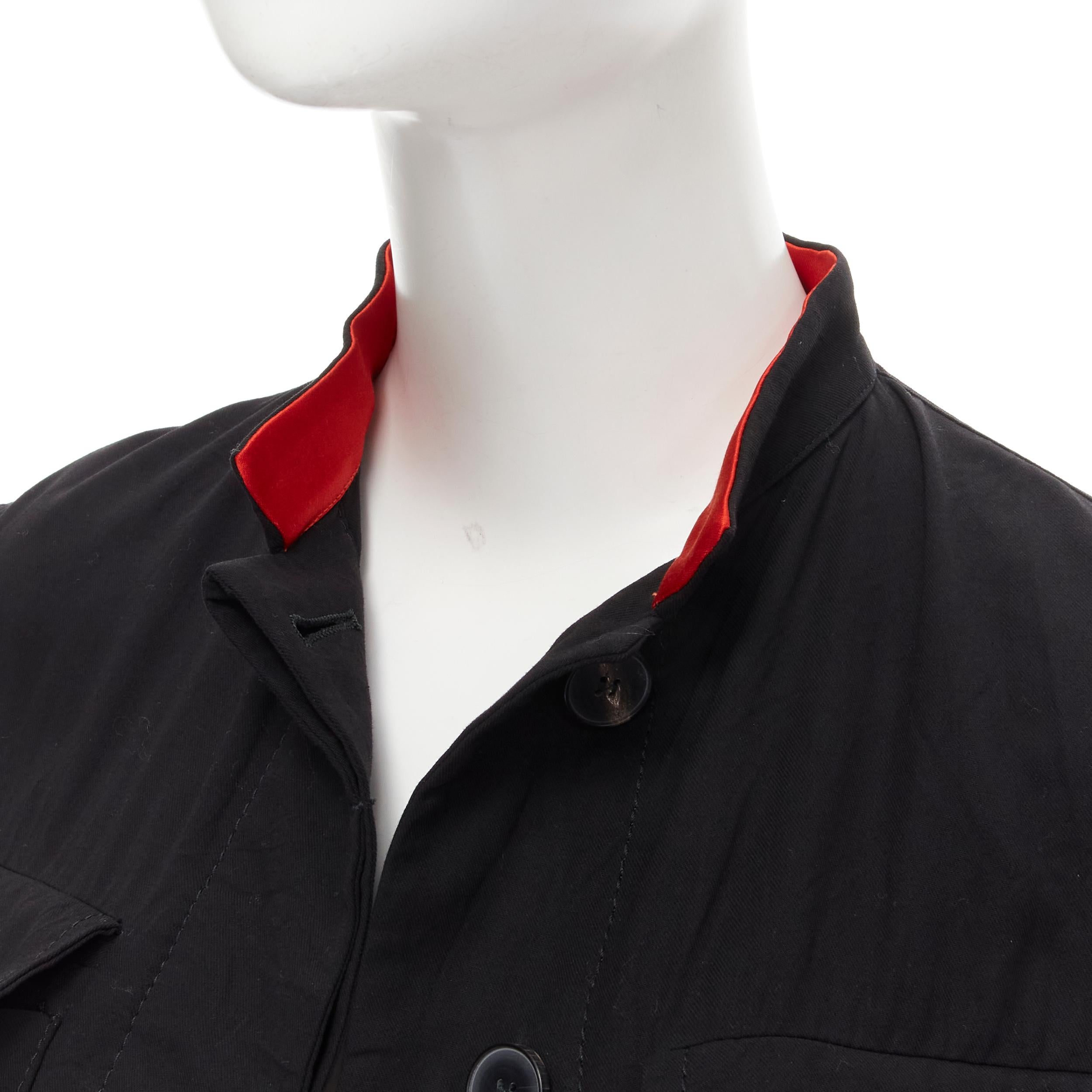 HAIDER ACKERMANN black cotton flap pockets red mandarin collar jacket FR34 XS 
Reference: MELK/A00026 
Brand: Haider Ackermann 
Material: Cotton 
Color: Black 
Pattern: Solid 
Closure: Button 
Extra Detail: 4 flap cargo pocket. Concealed buttons.