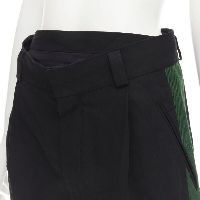 Black HAIDER ACKERMANN black green grosgrain trimmed side pleated front shorts FR34 XS For Sale