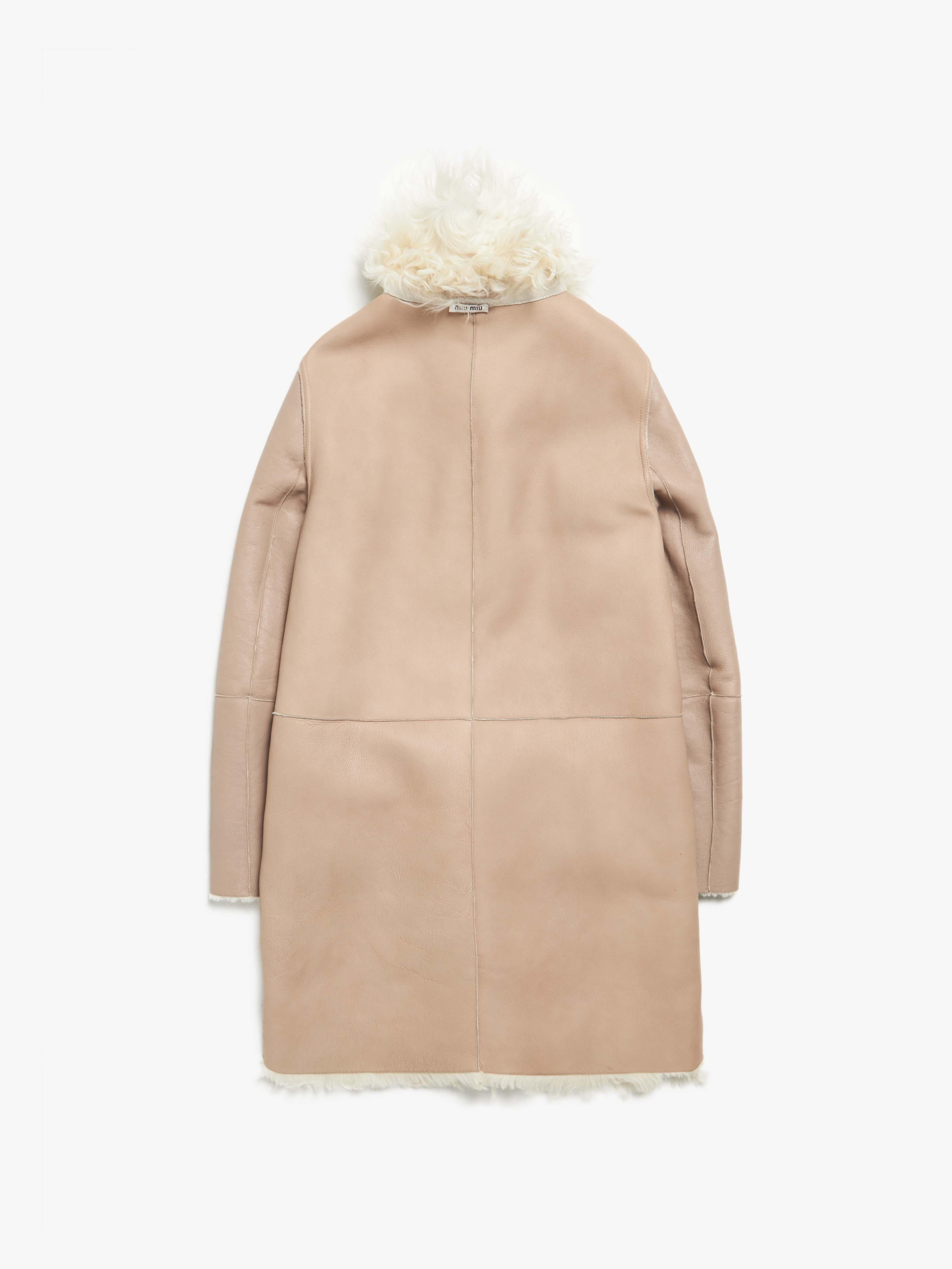 Miu Miu  Ivory Reversible Shearling Coat
Size marked: S
Condition: Gently used
Material: 100% Shearling
Measurements: 
(124421)
