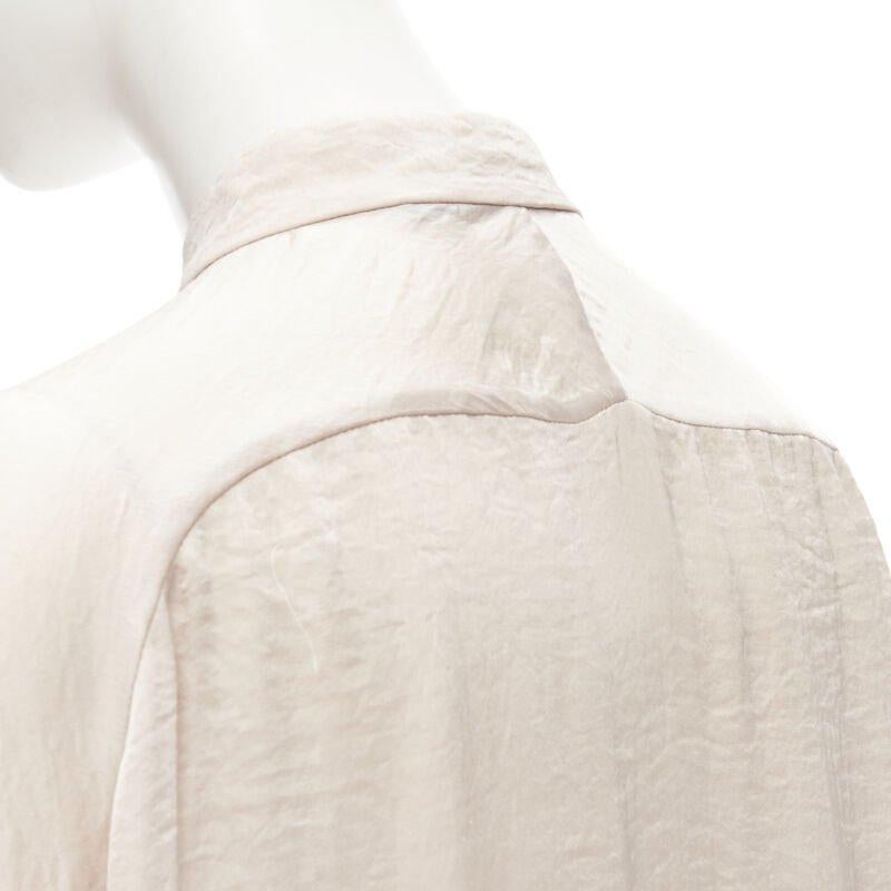 HAIDER ACKERMANN hammered polyester blush pink oversize shirt  FR38 M
Reference: CNLE/A00166
Brand: Haider Ackermann
Designer: Haider Ackermann
Material: Polyester
Color: Pink
Pattern: Solid
Closure: Button

CONDITION:
Condition: Very good, this